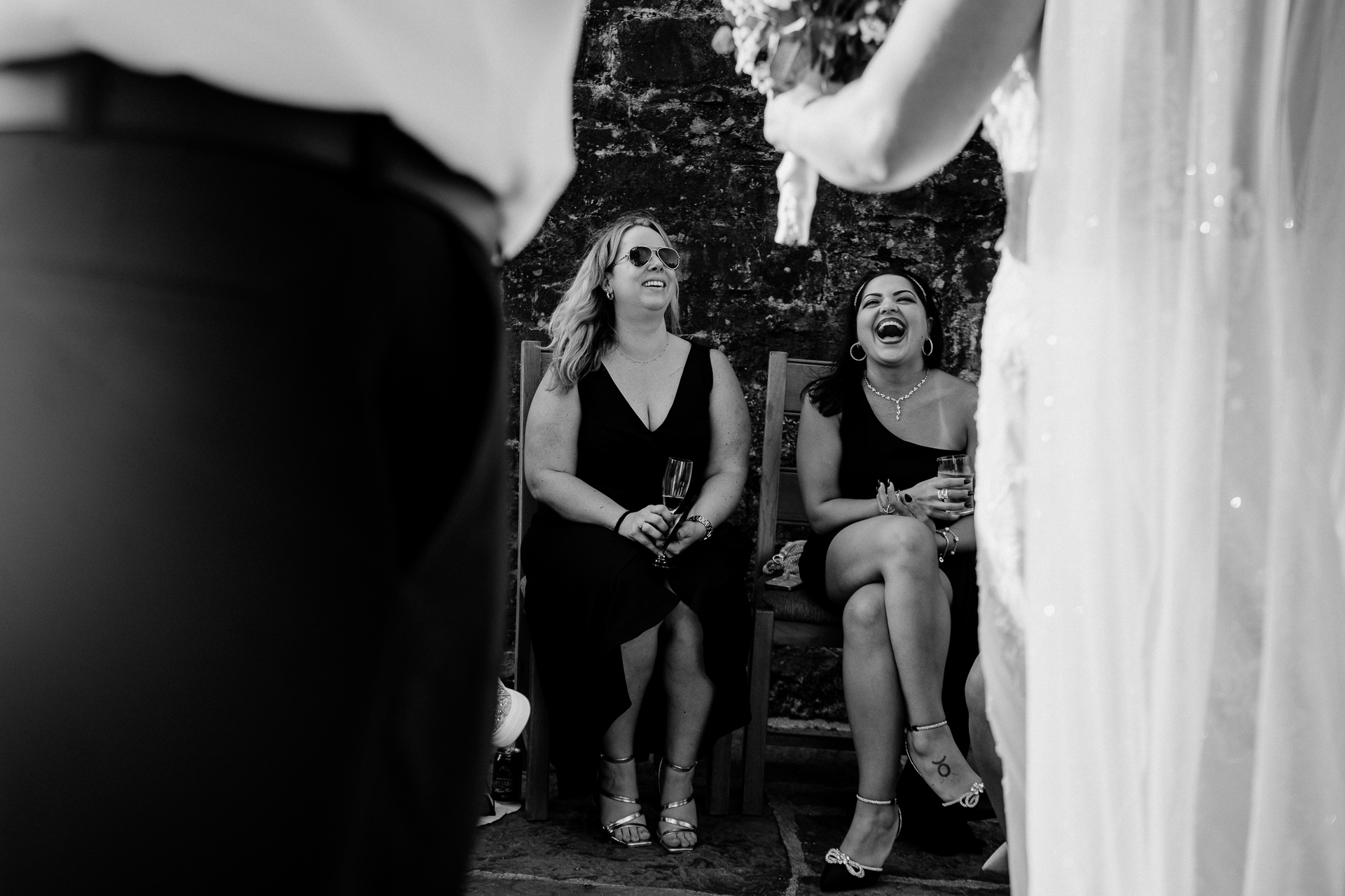 A couple of women sitting on a bench