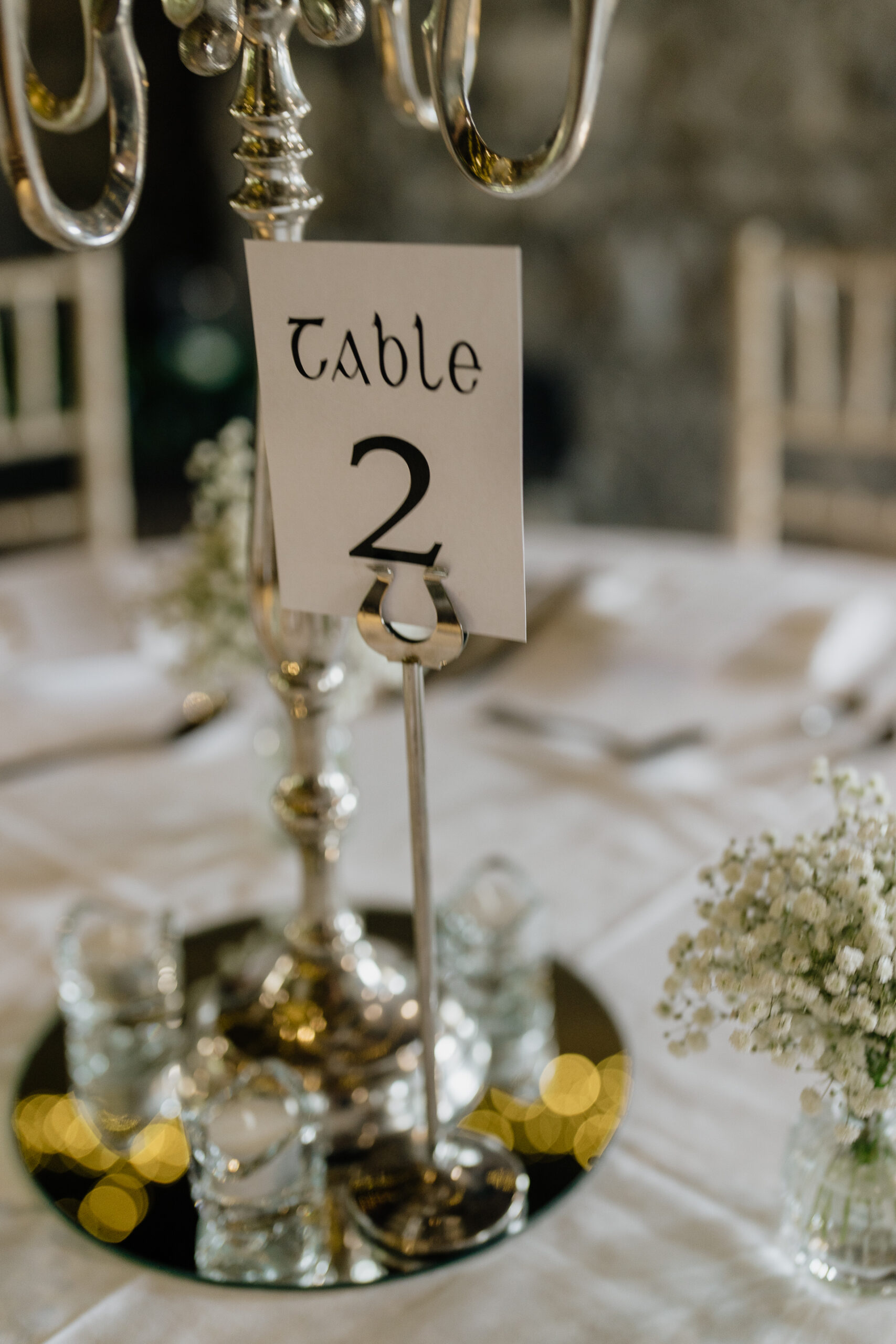 A table with a sign and glasses