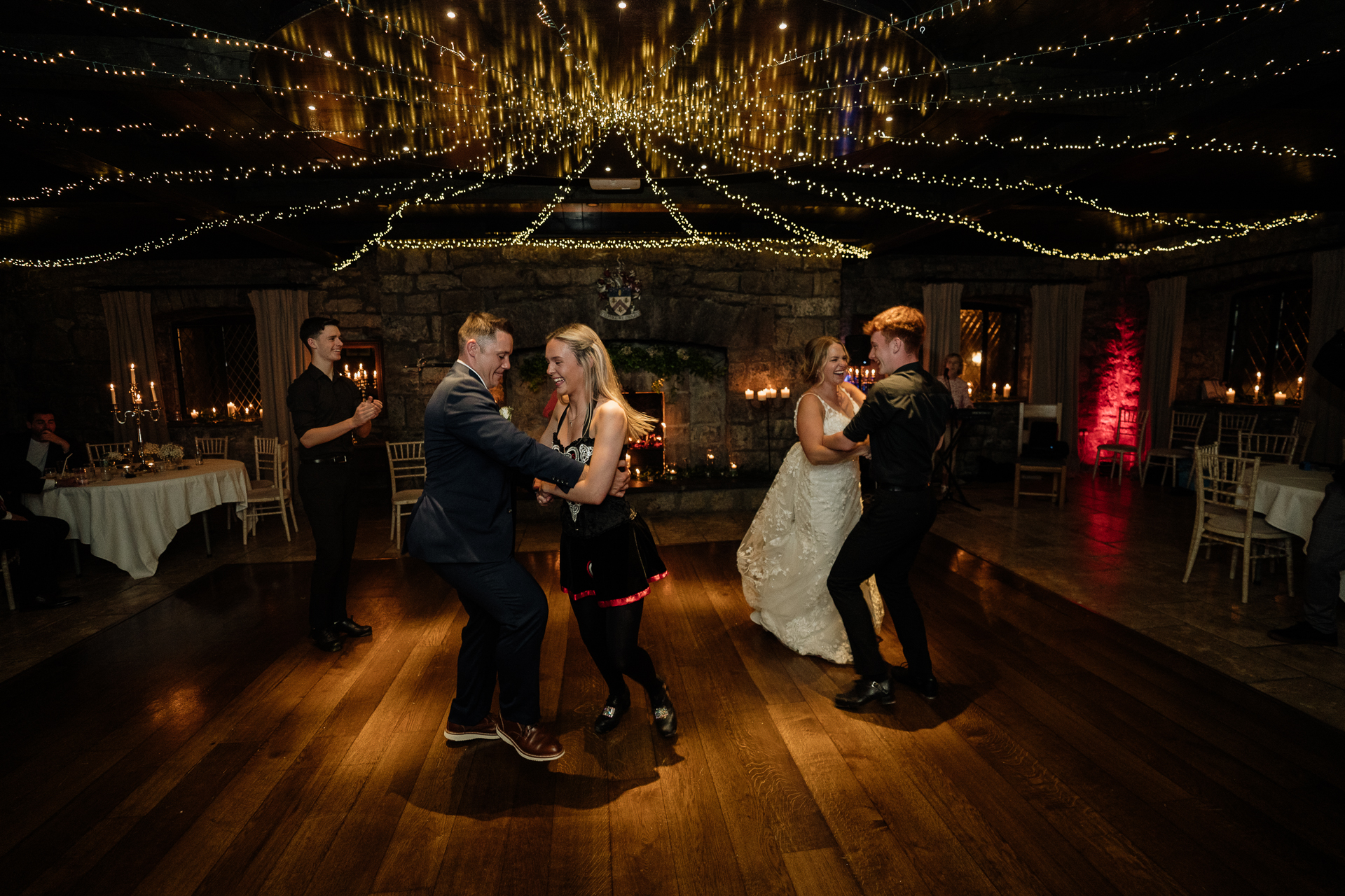 A man and woman dancing at a wedding reception