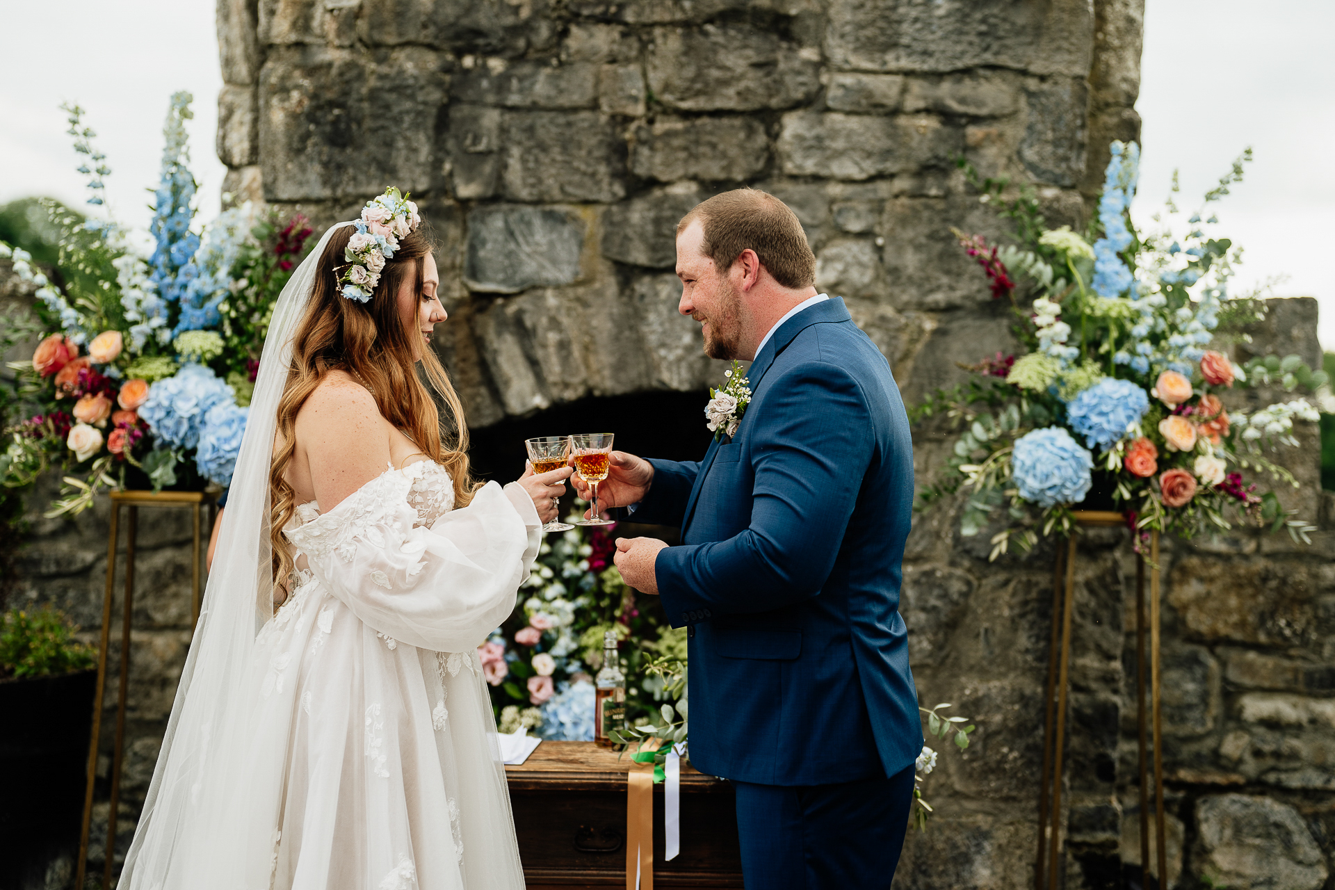 A man and woman holding drinks