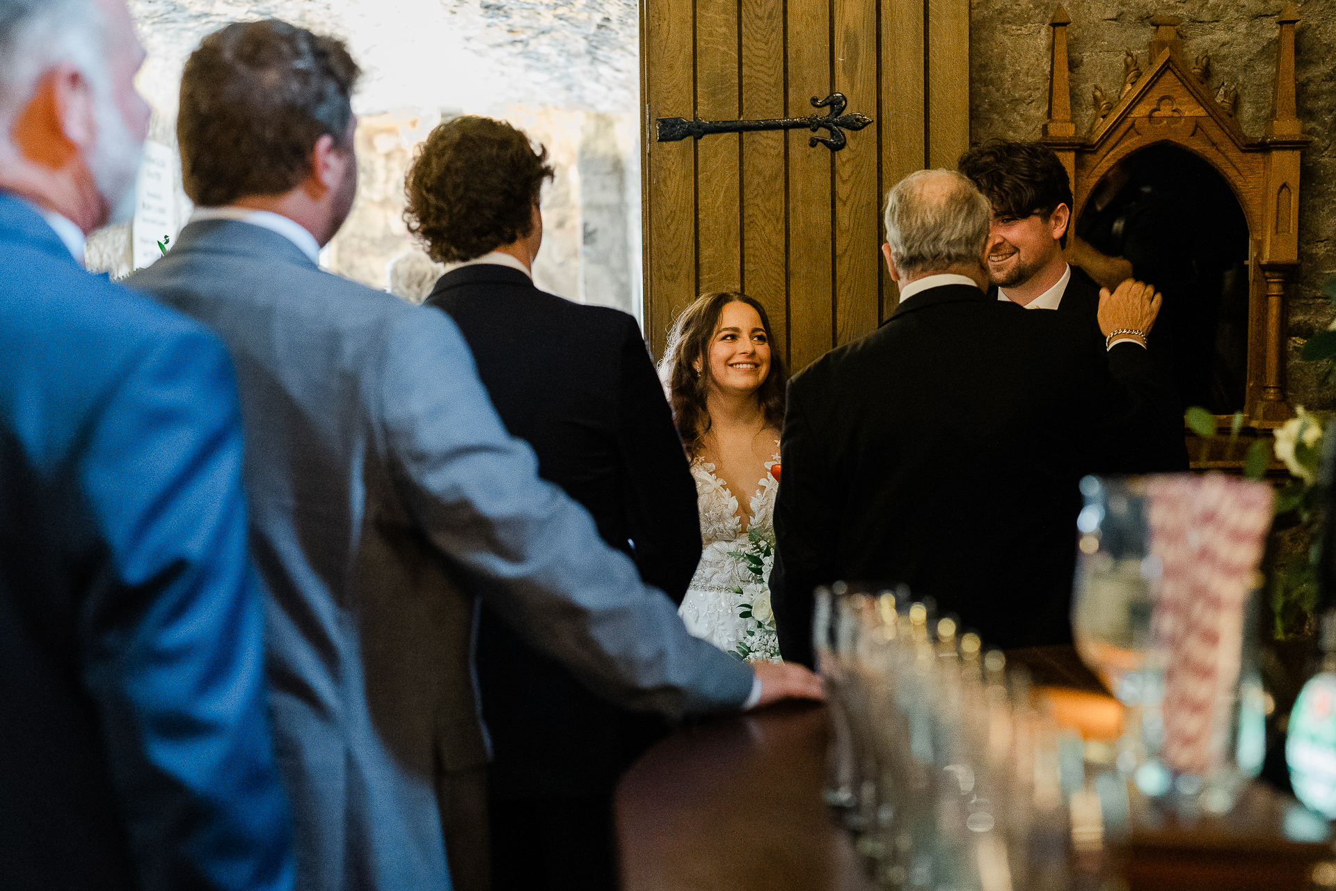 A group of people standing around a table