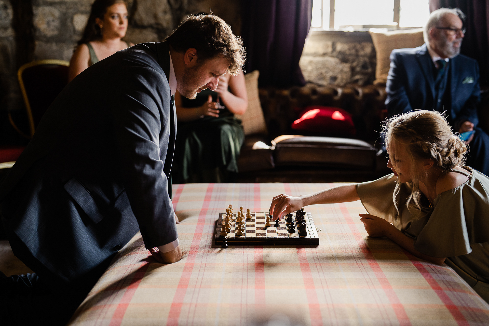 A man and a woman playing chess