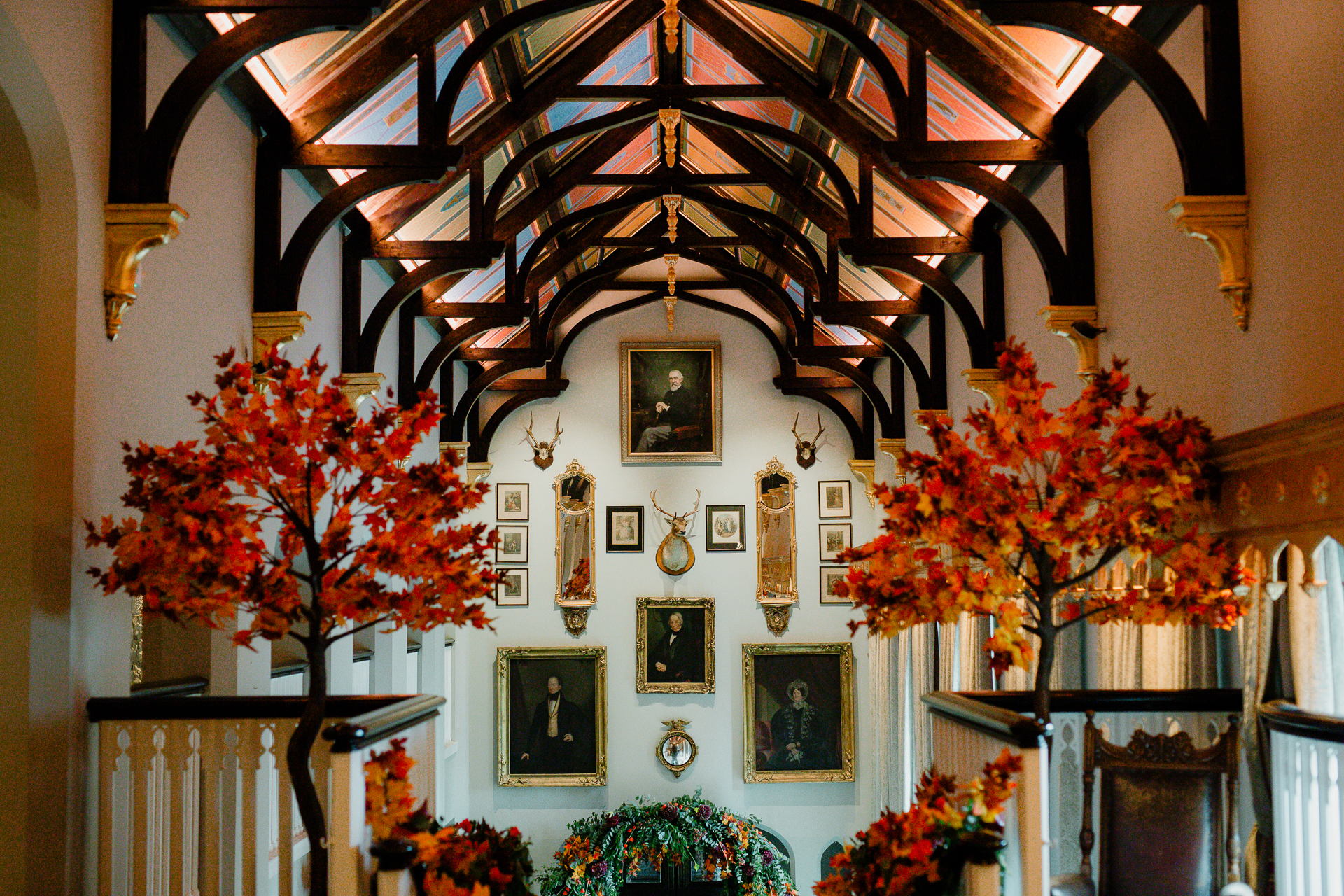 A room with a large chandelier and flowers