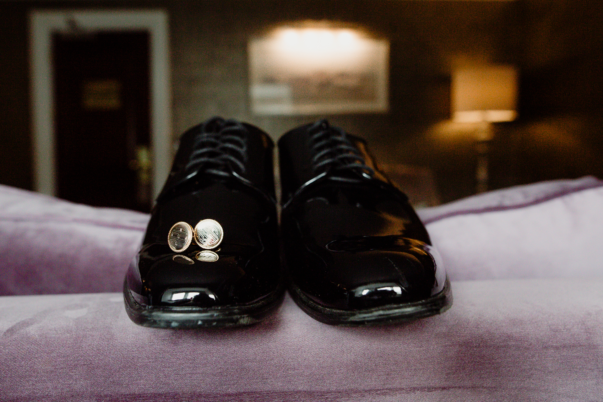 A pair of shoes on a bed