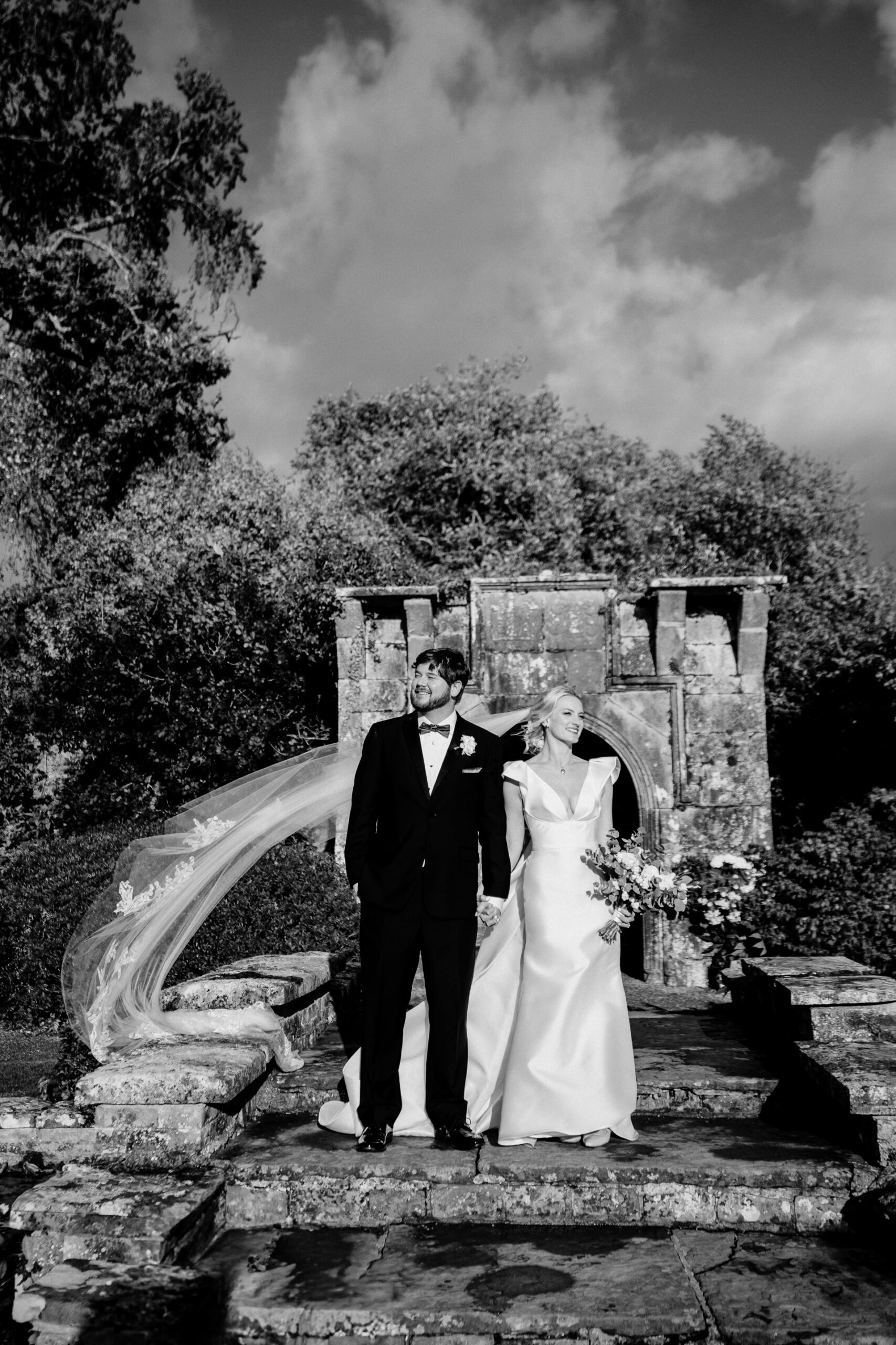 A bride and groom posing for a picture