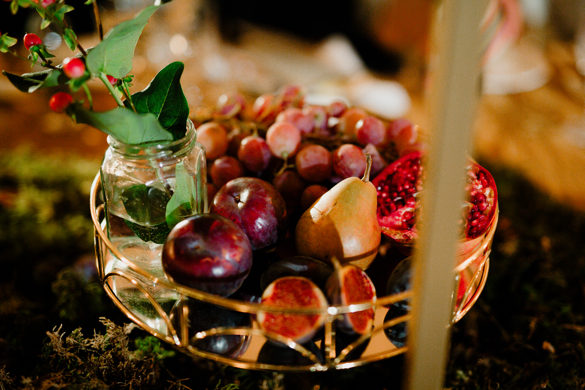 A glass bowl with fruit in it