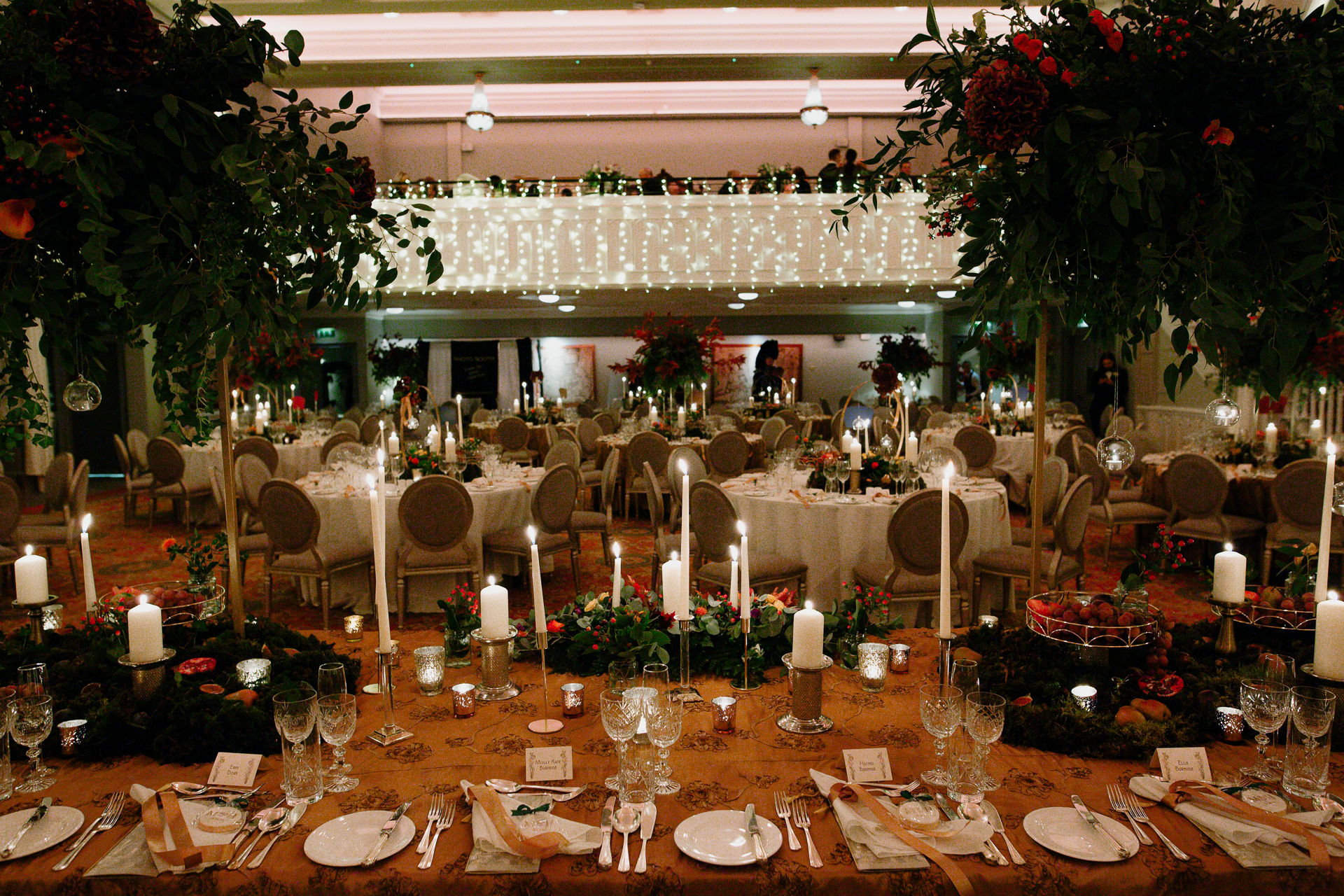 A large dining room with tables set for a meal