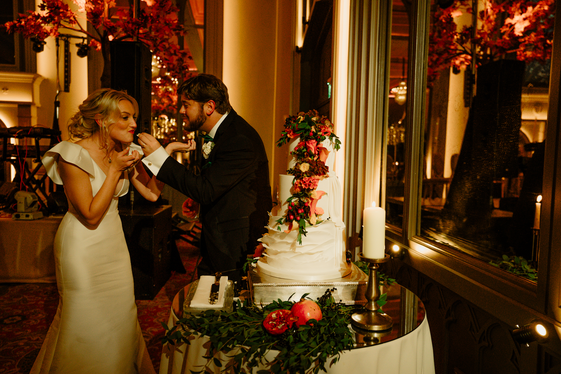 A bride and groom cutting a wedding cake