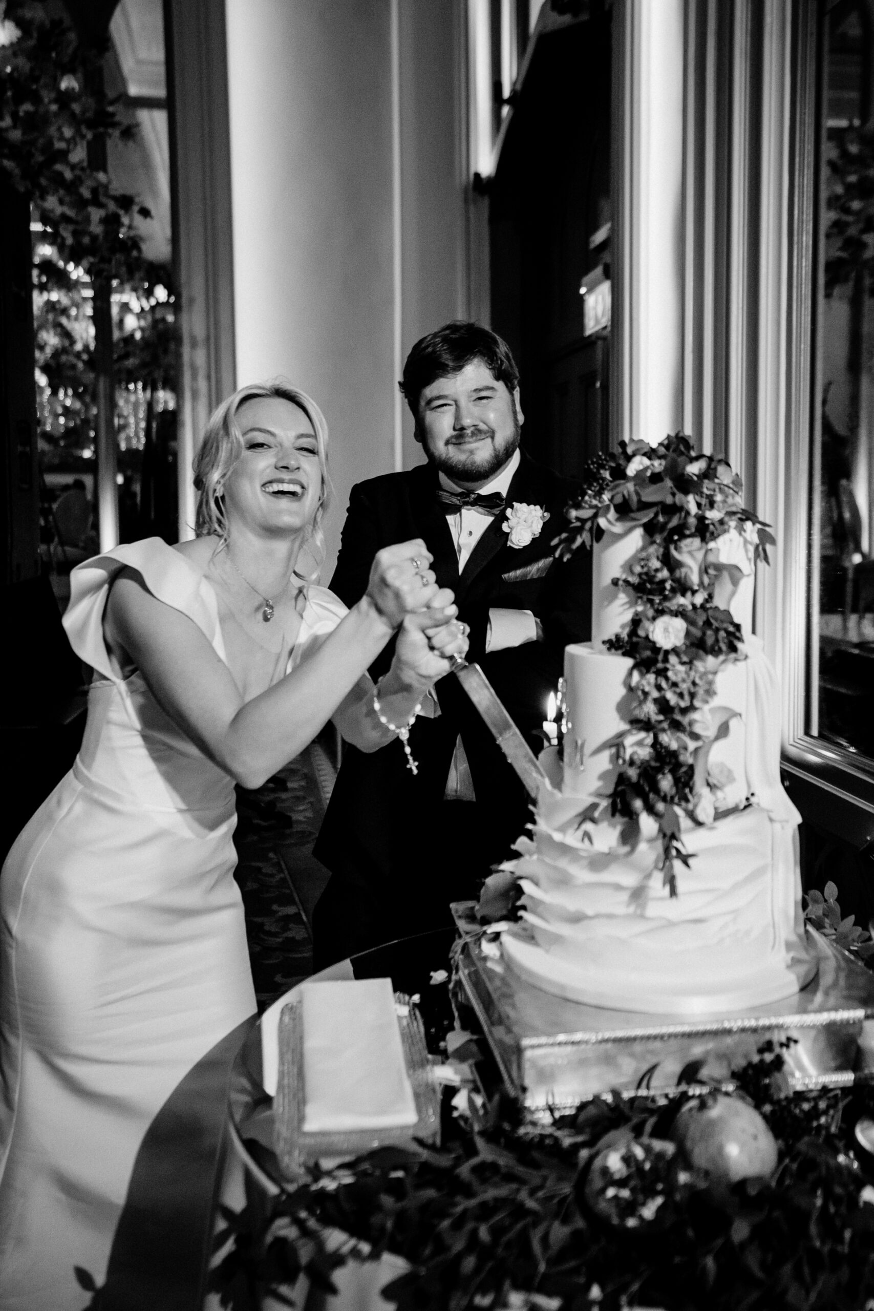 A bride and groom cutting a wedding cake