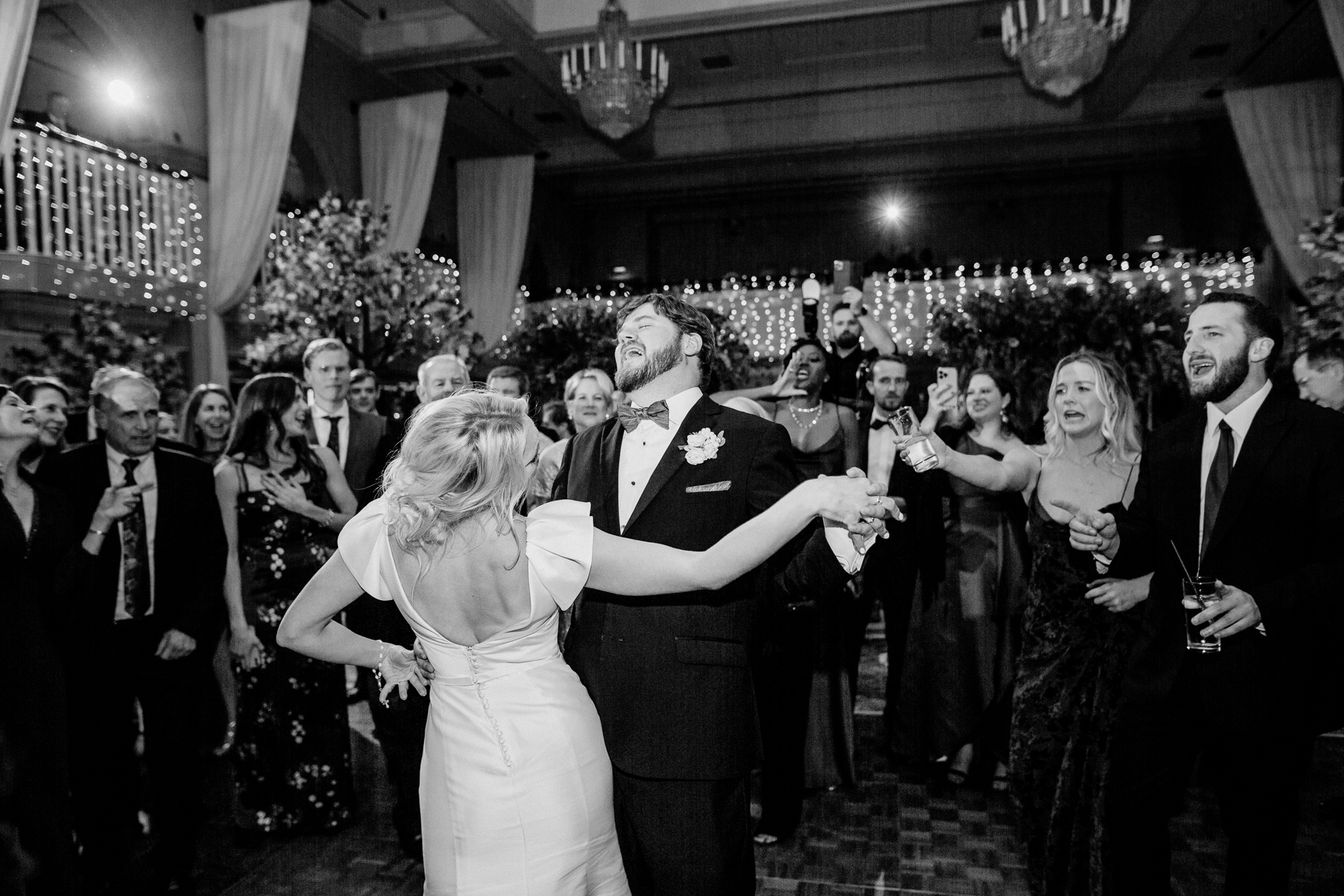 A man and woman dancing at a wedding reception