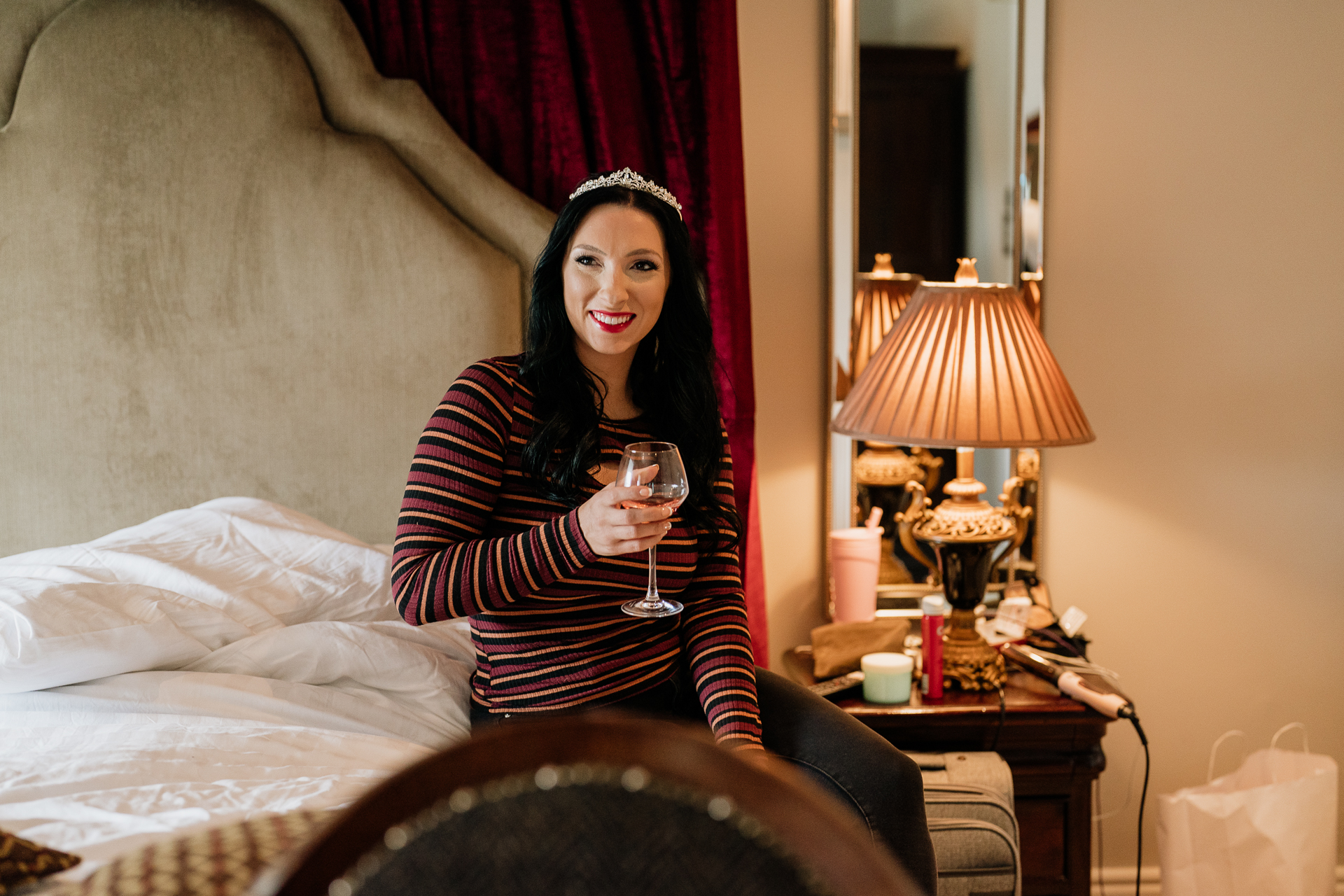 A woman holding a glass of wine