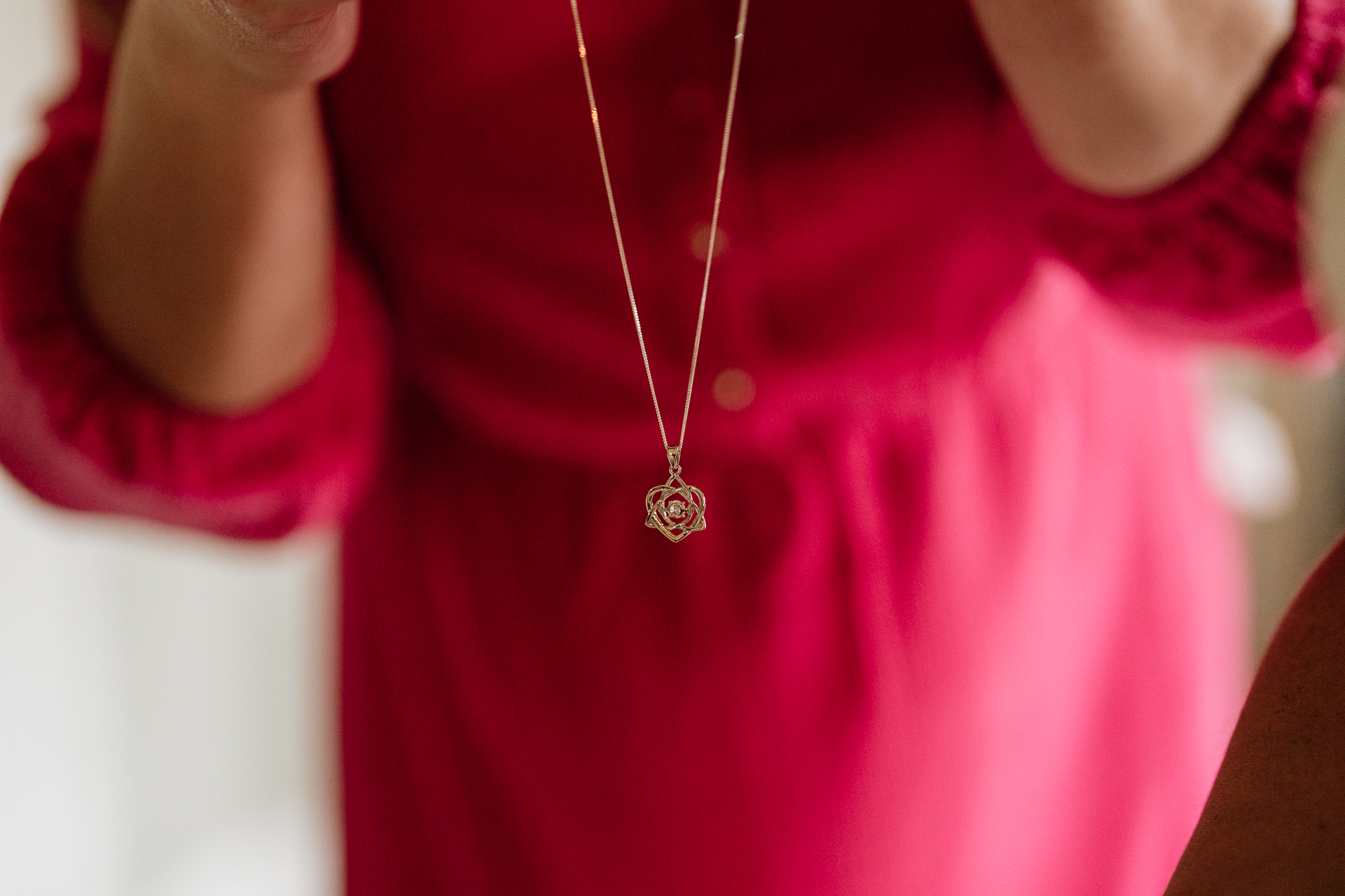 A close-up of a woman's necklace