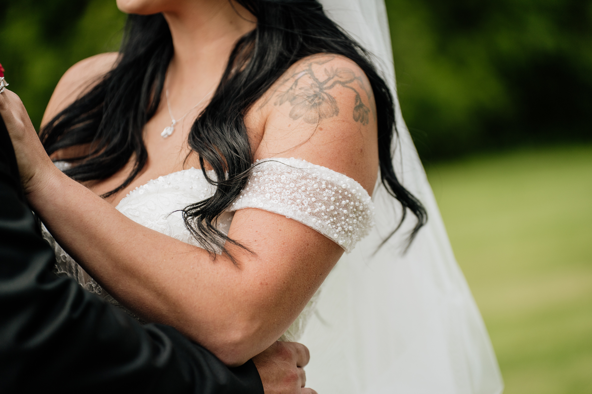 A woman with her arms around a man's neck