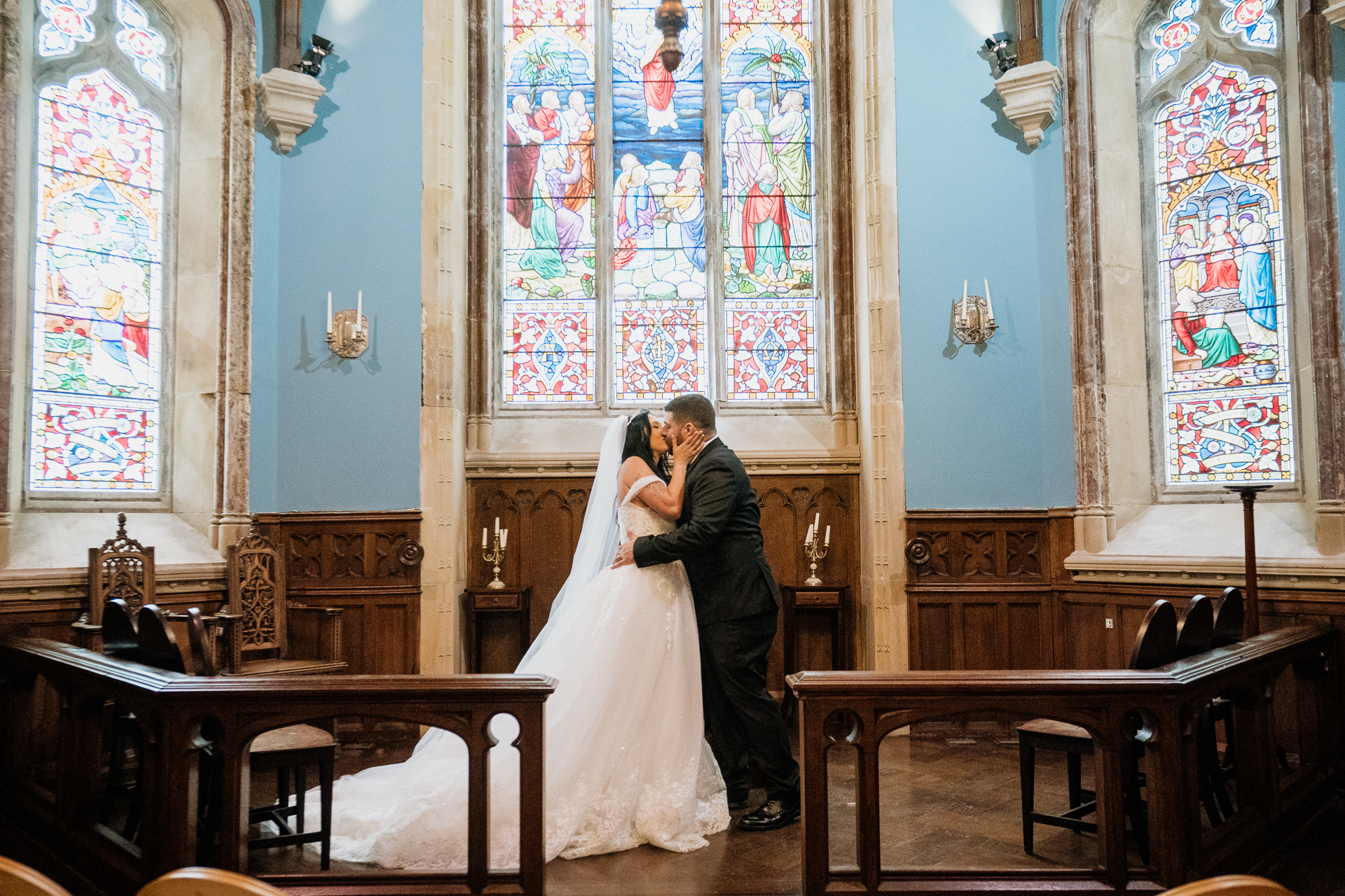 A man and woman kissing in a church