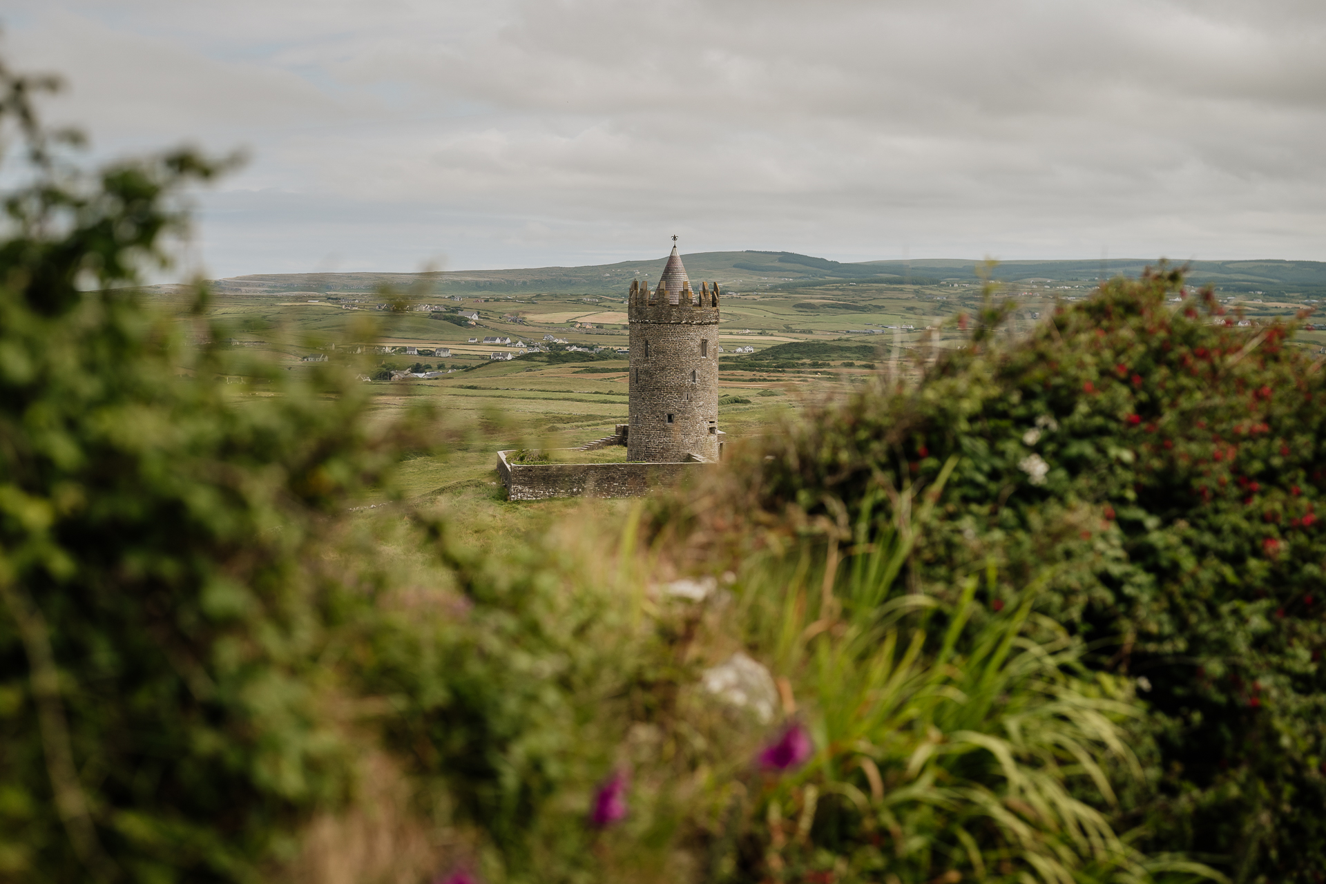 A stone tower in a forest