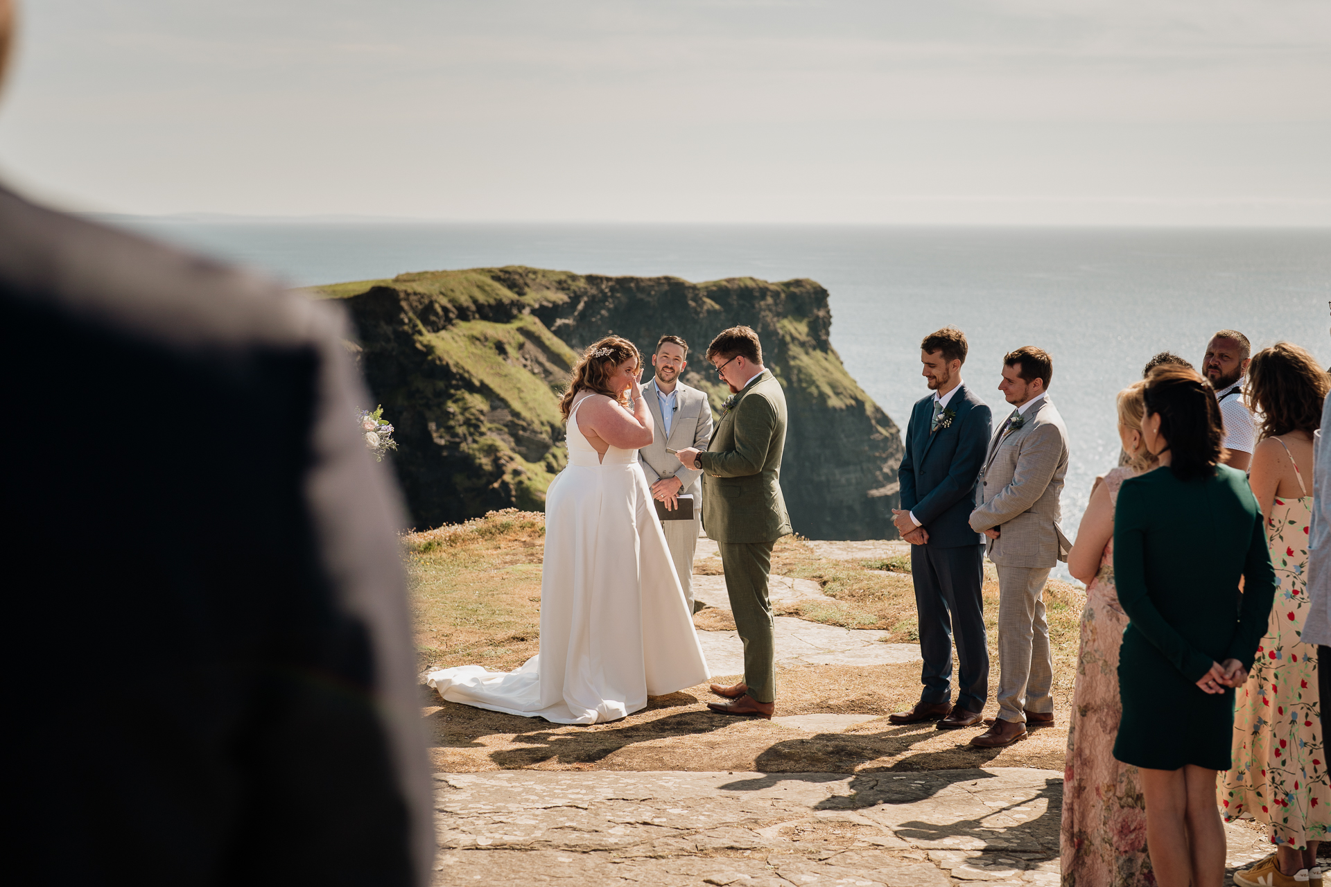 A wedding party on a cliff