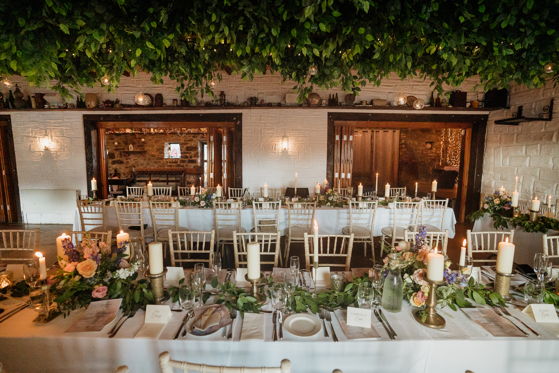 A table with candles and flowers