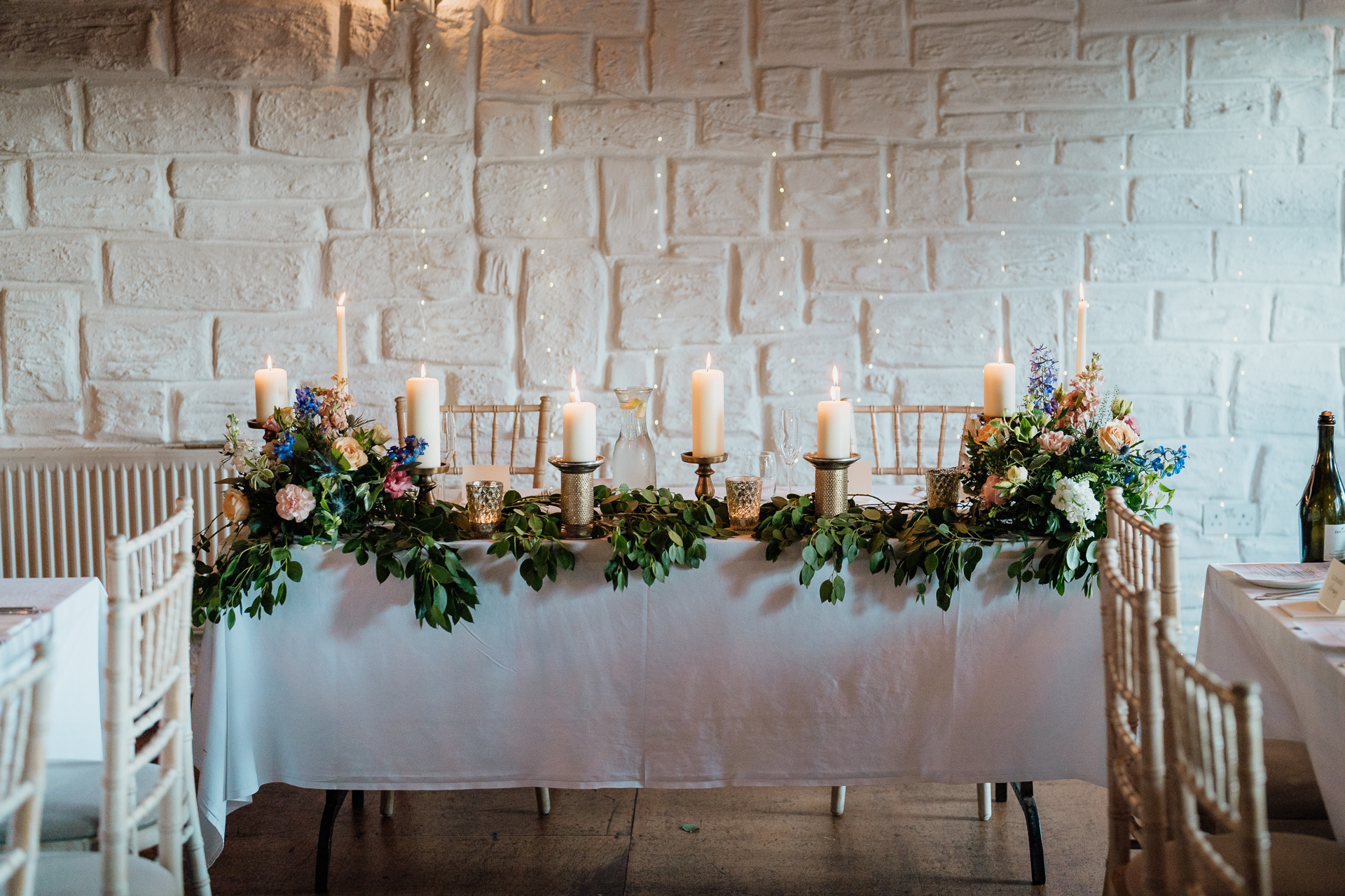 A table with candles and flowers