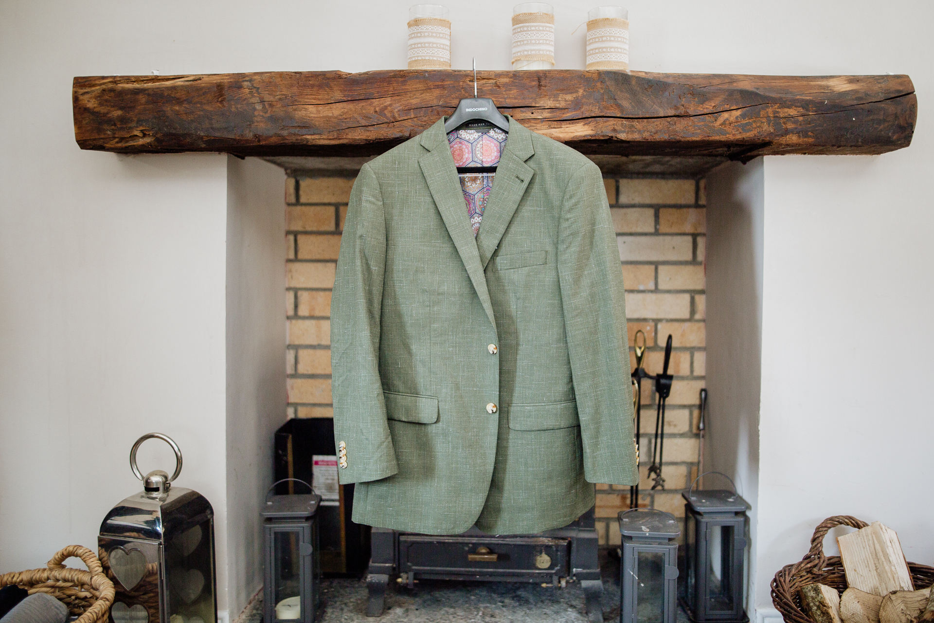 A green coat from a ceiling