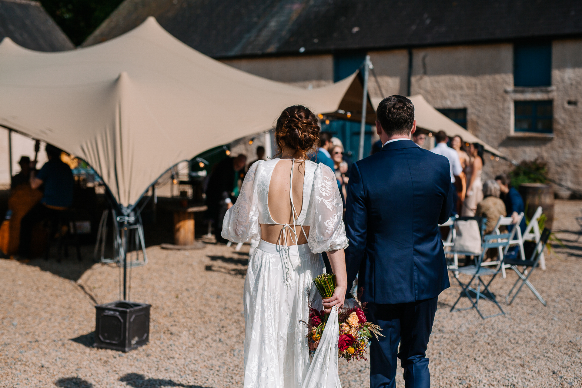 A man and woman holding flowers