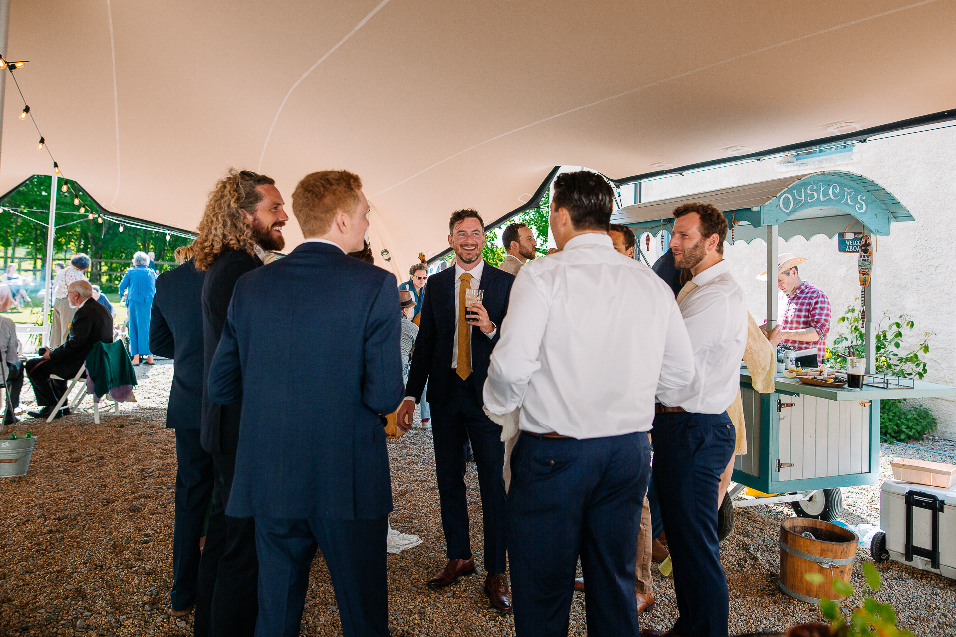 A group of people standing in a tent