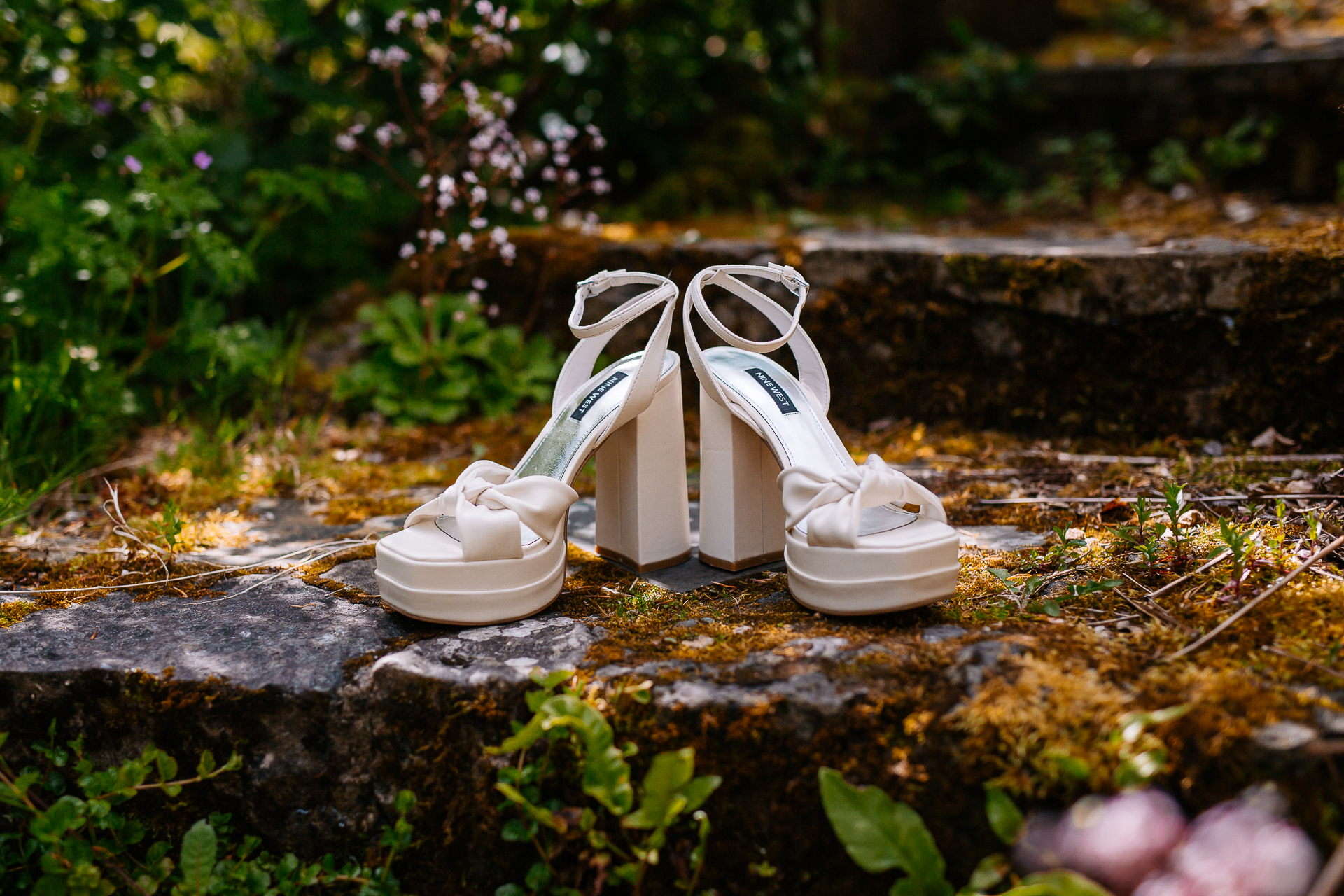 A pair of white shoes on a rock