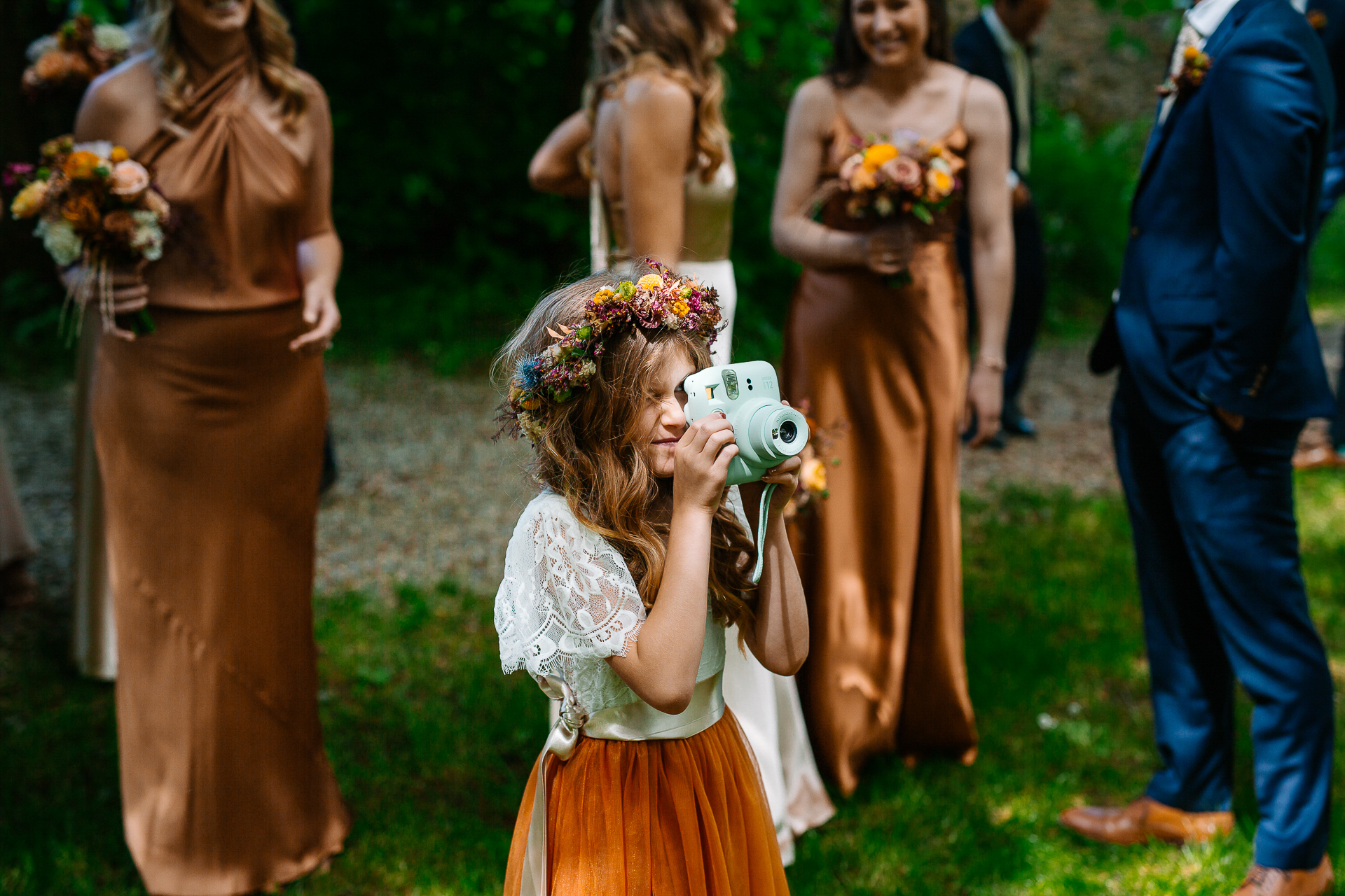 A little girl holding a camera