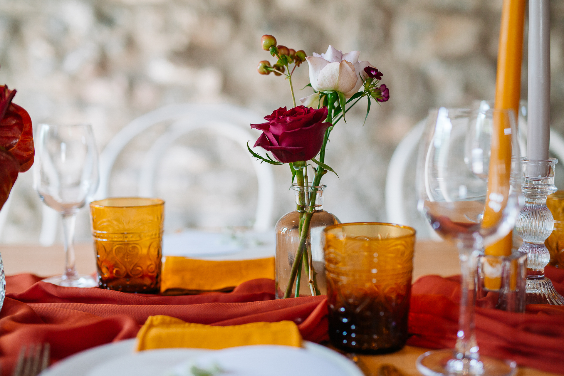 A table with glasses and flowers