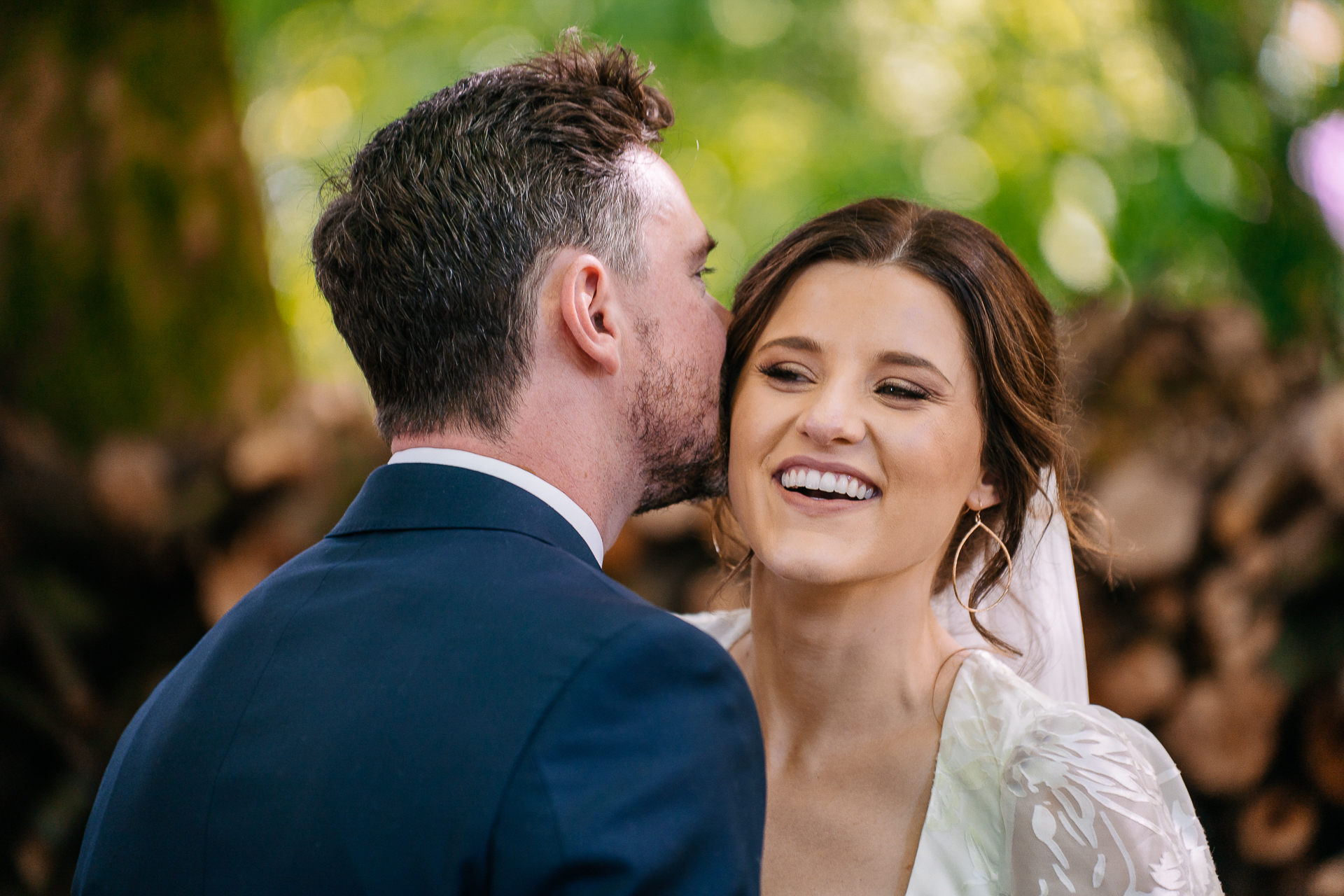 A man kissing a woman on the cheek