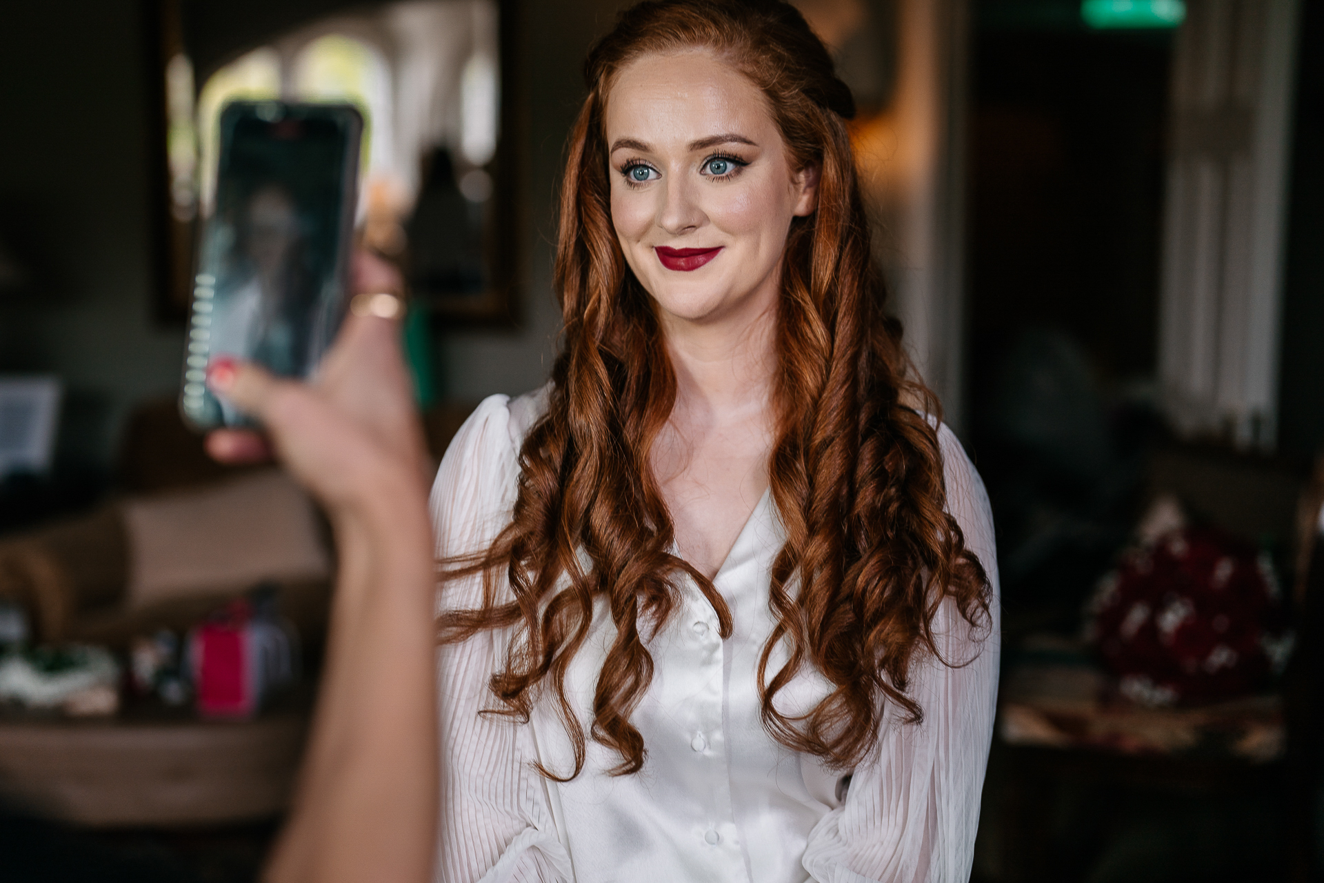 A woman holding a phone