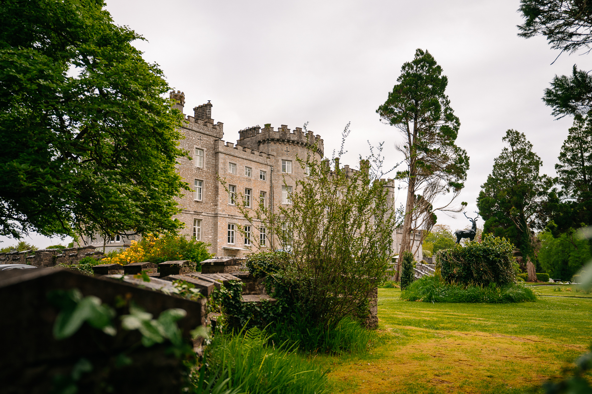 A large building with trees and grass