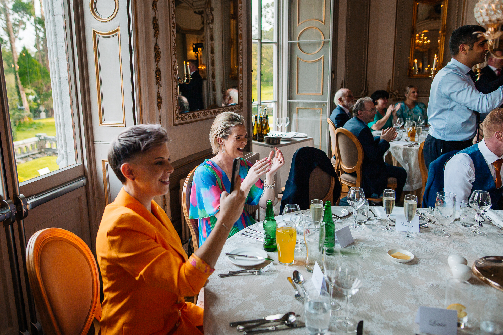 A group of people sit around a table