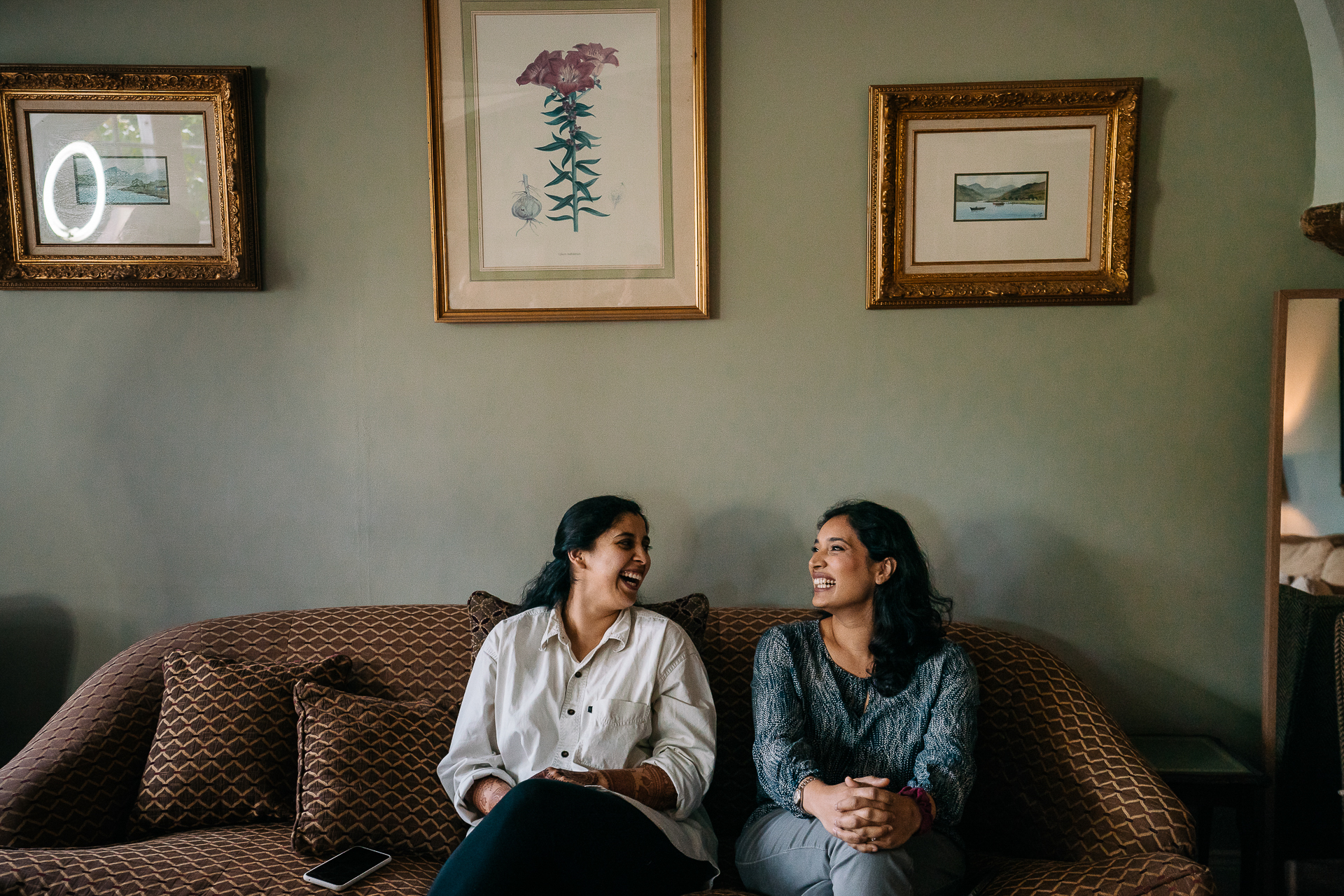 Two women sitting on a couch