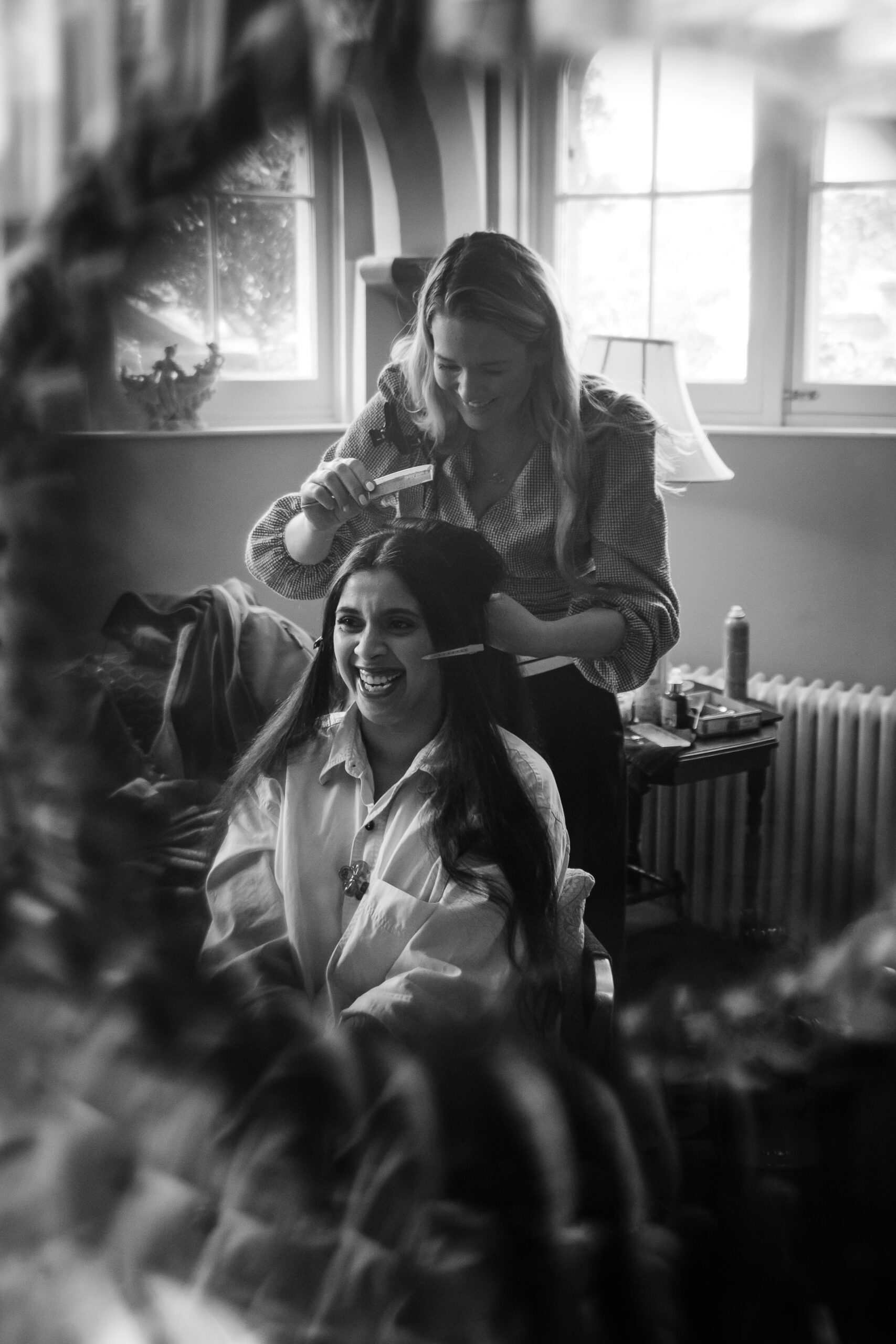 A couple of women sitting on a couch