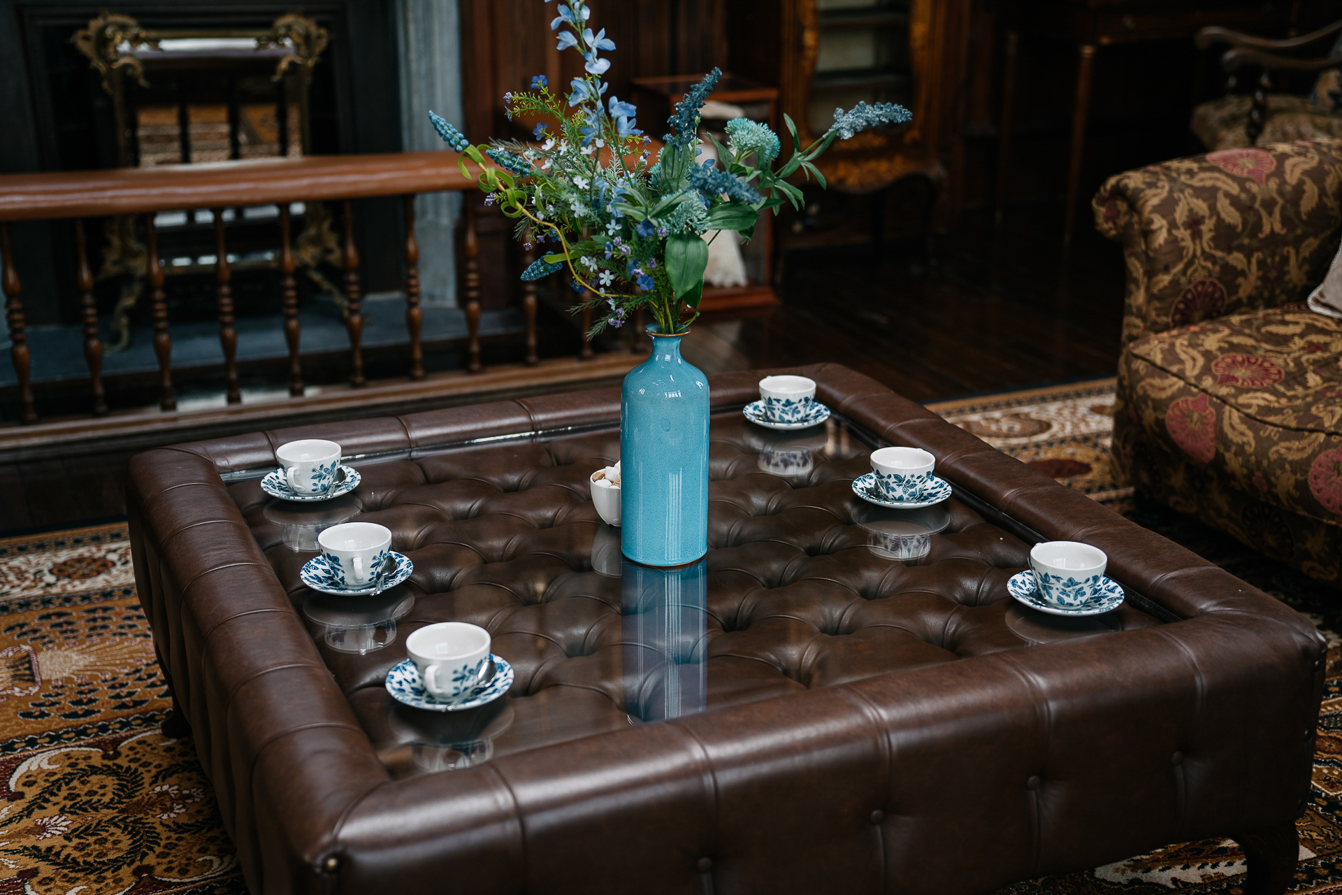 A vase with flowers on a coffee table