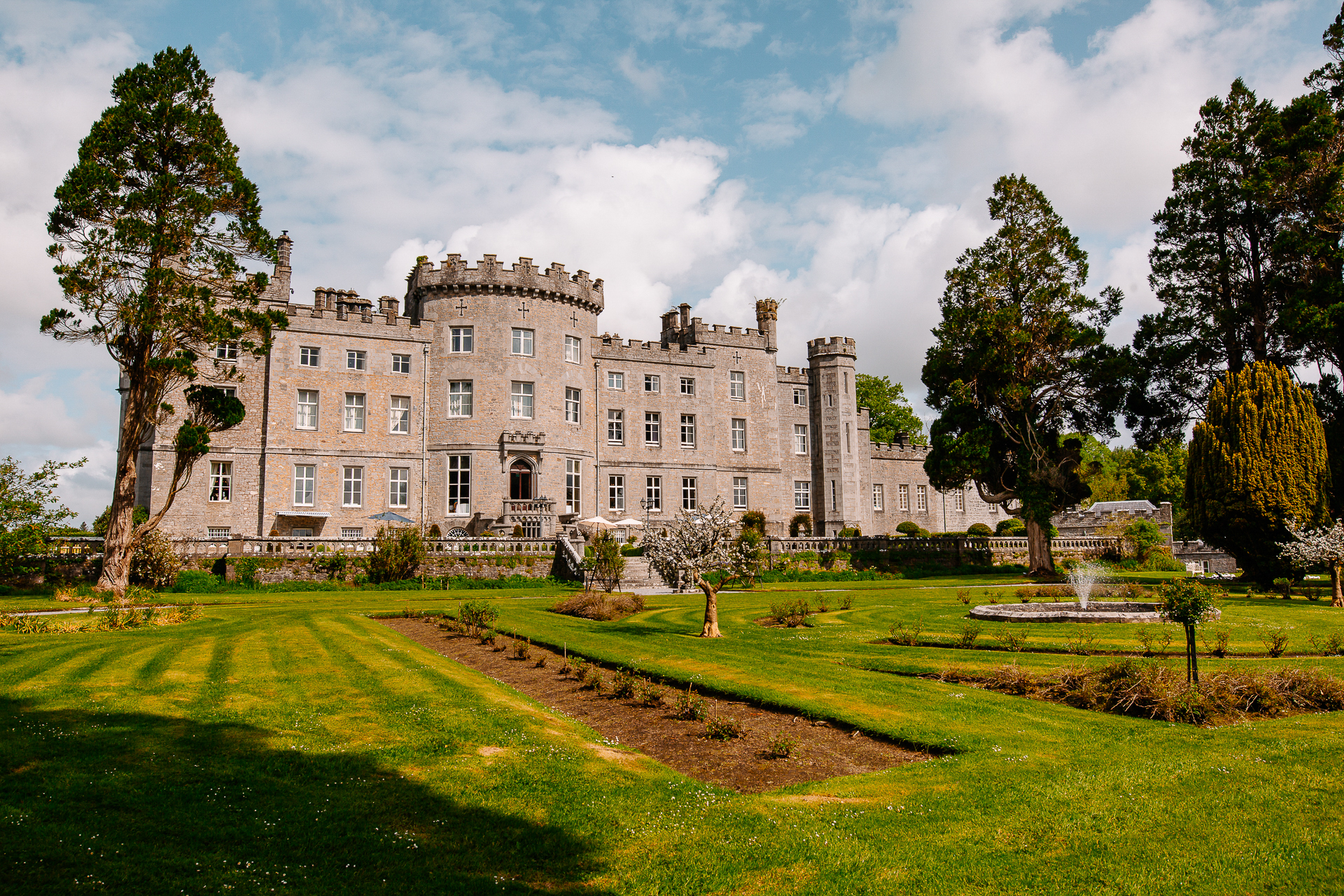 A large building with trees and grass