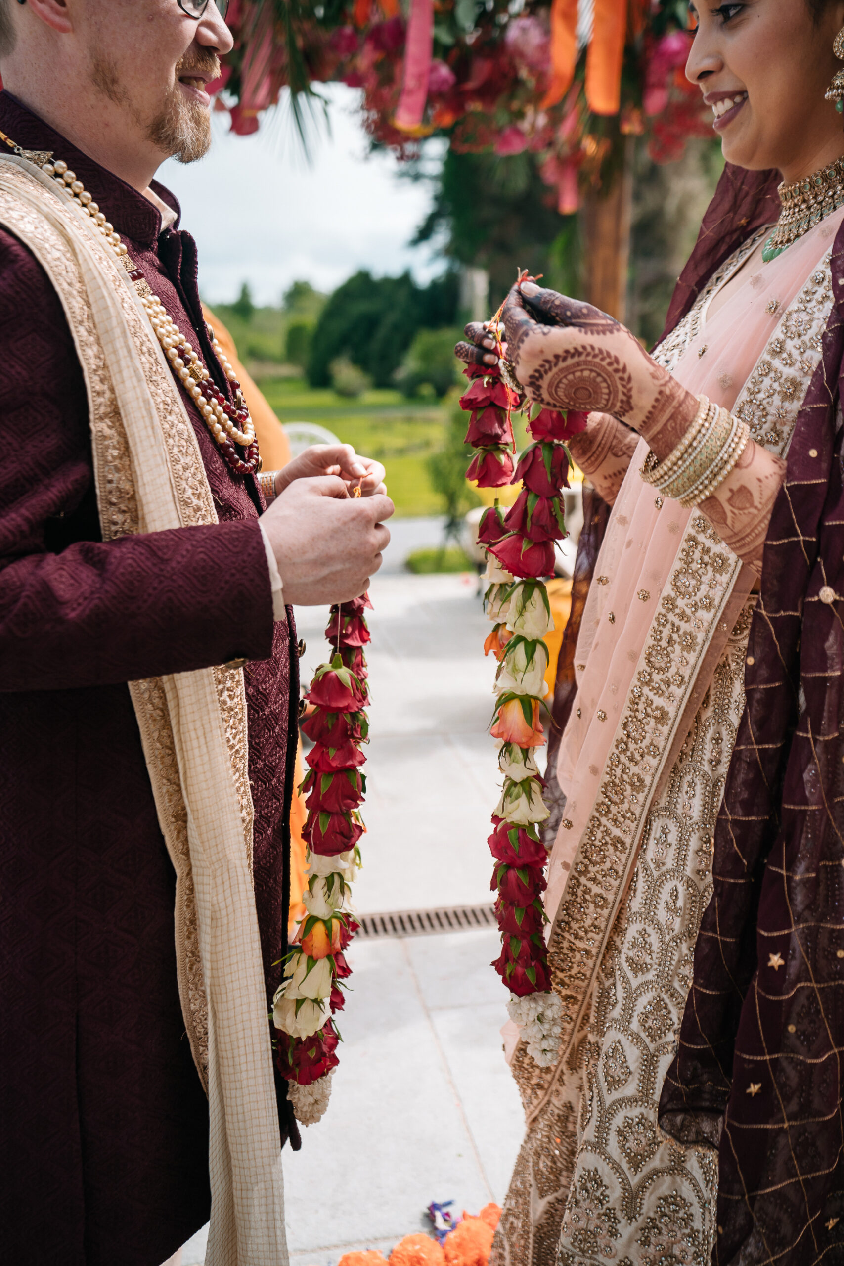 A man and woman holding flowers