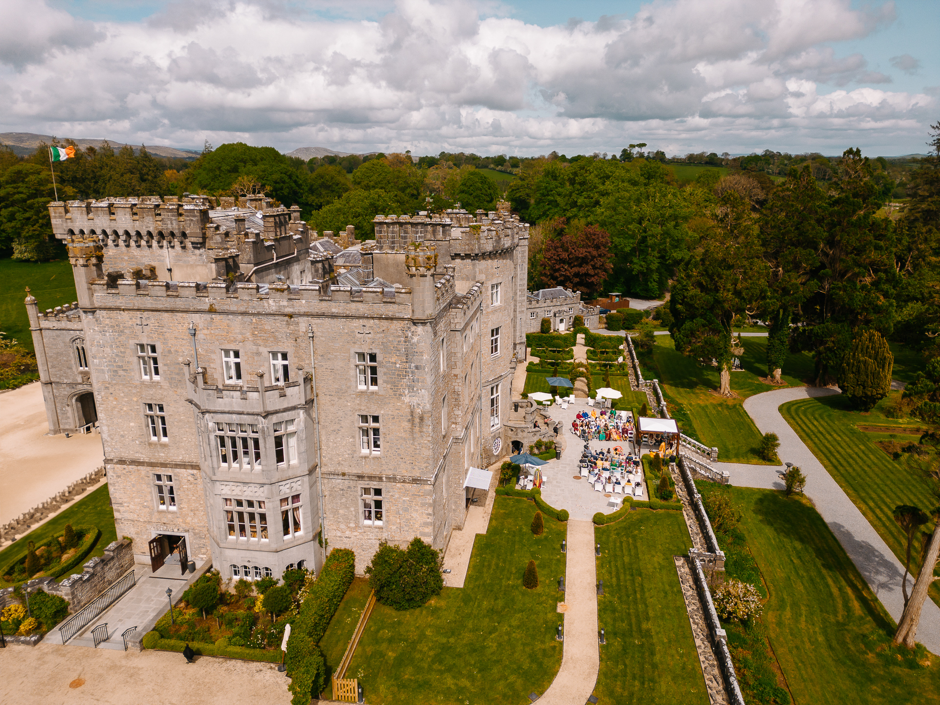 A castle with a lawn and trees