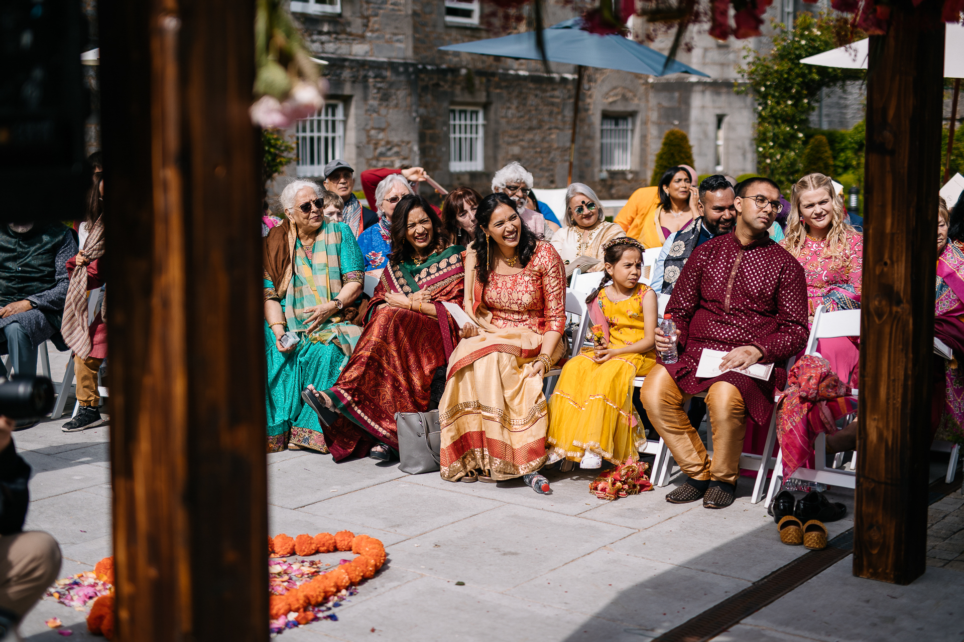 A group of people sitting outside