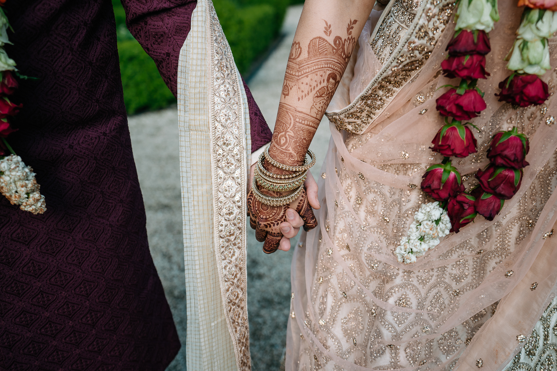 A person wearing a dress and holding a bouquet of flowers