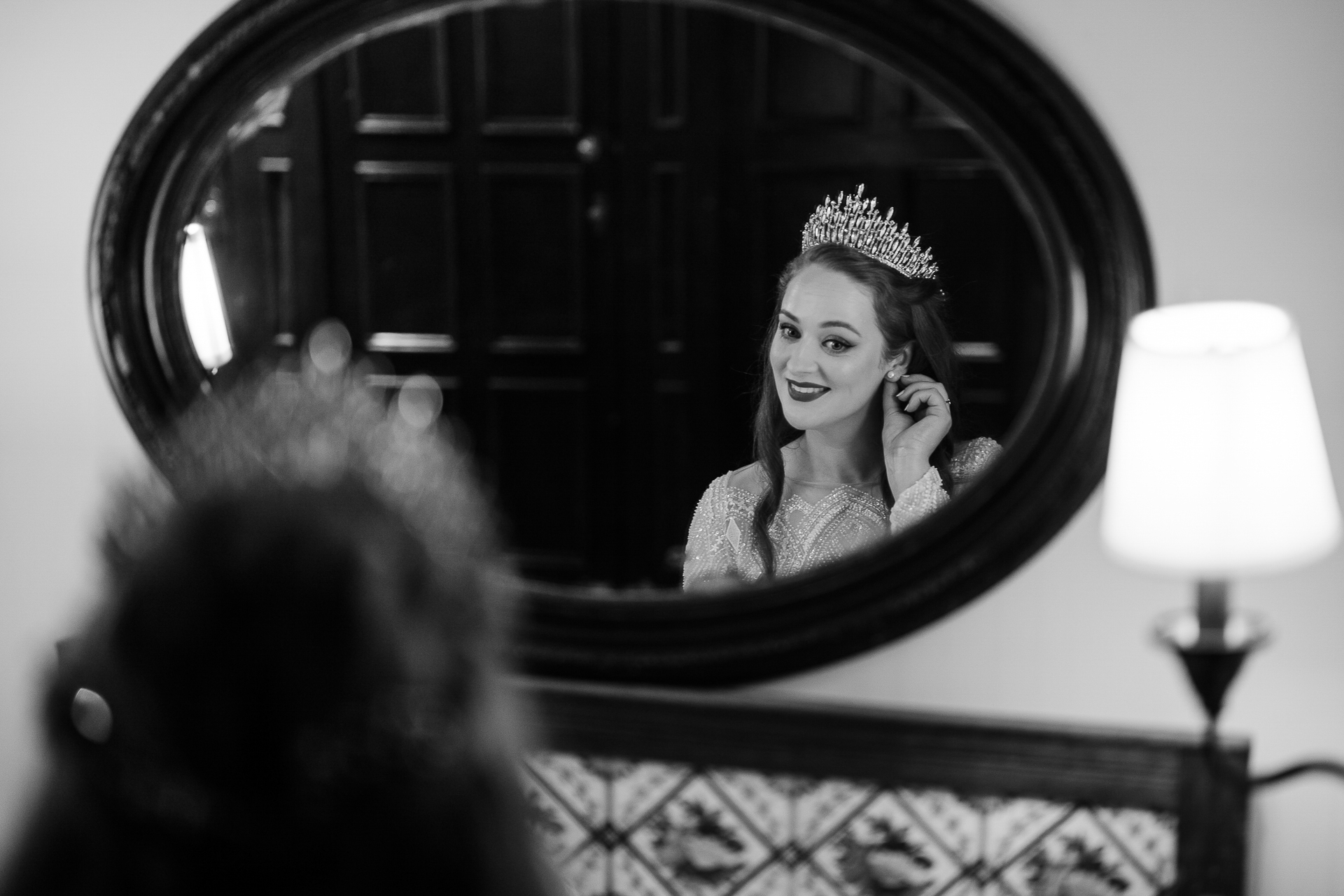 A woman in a crown talking on a cell phone