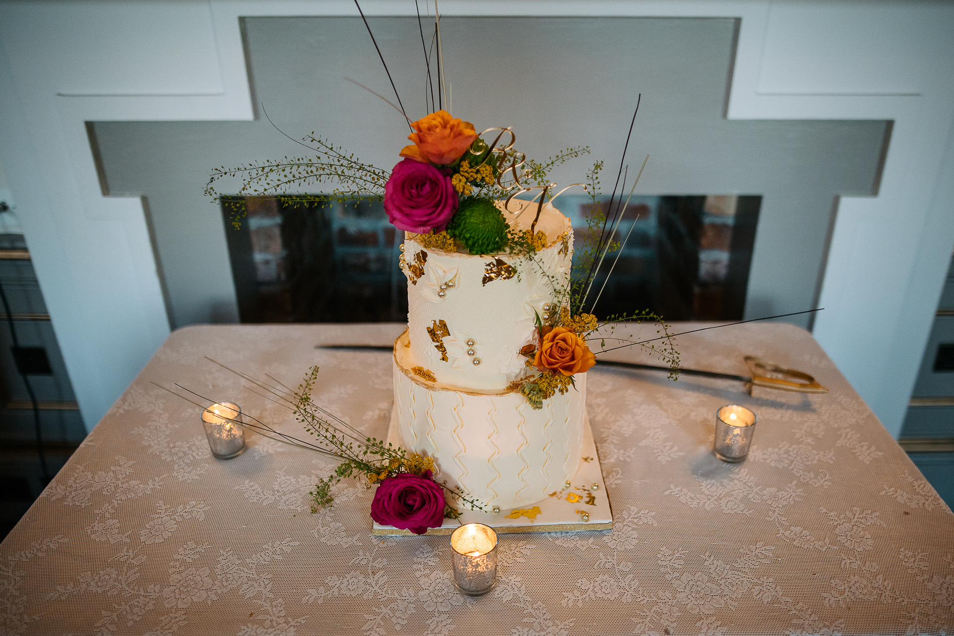 A wedding cake with flowers on top