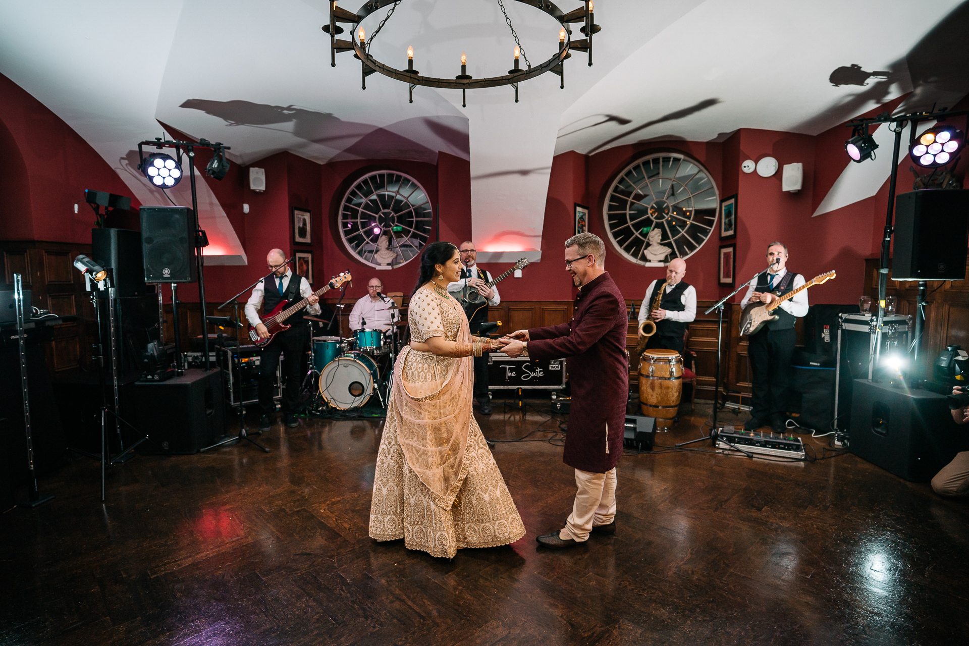 A man and woman dancing on a stage with instruments