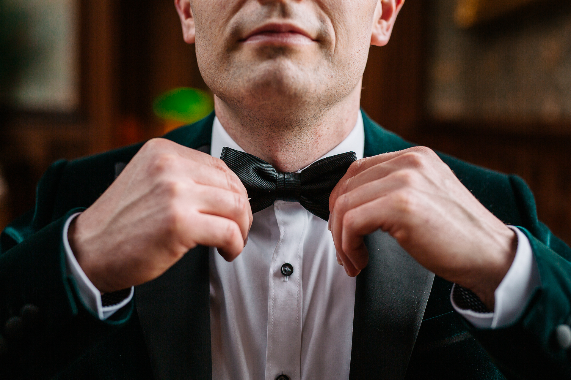 A man in a suit and bow tie