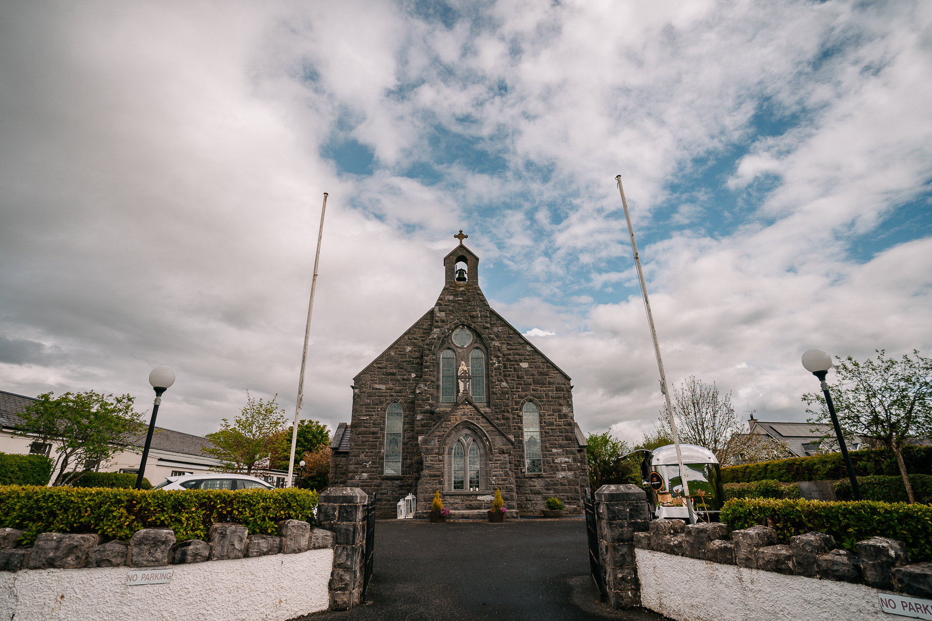 A stone church with a cross on top