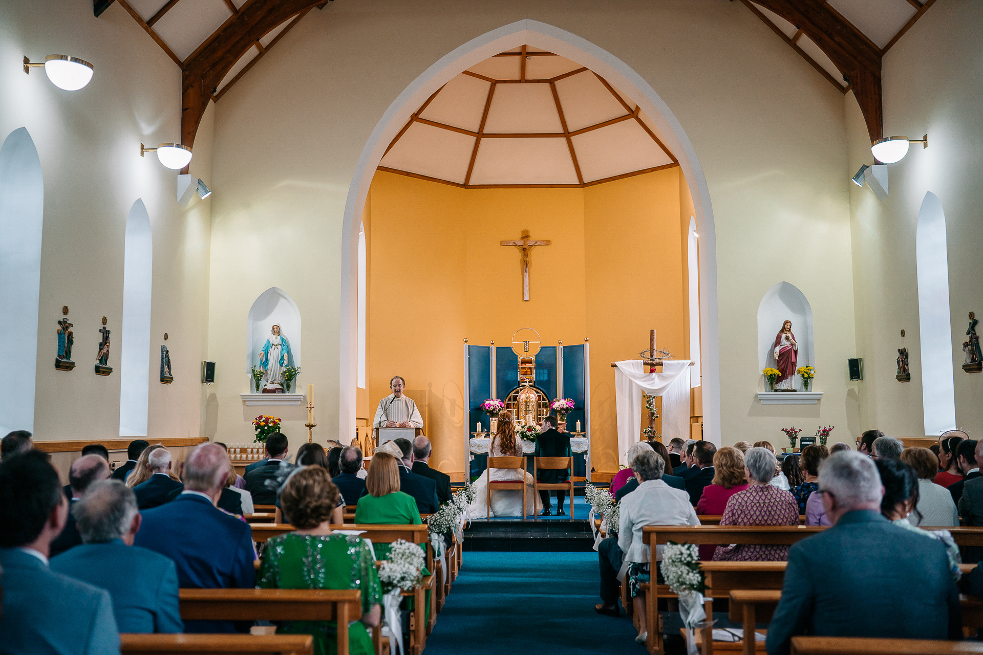 A group of people sitting in a church