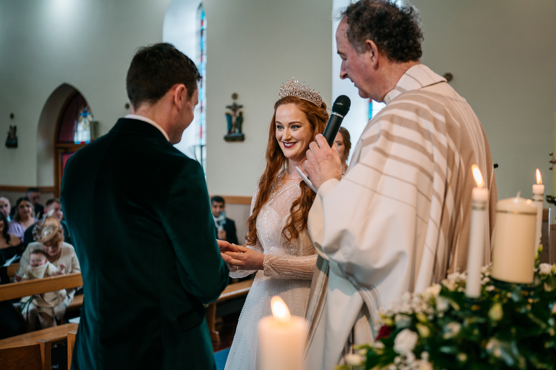 A man taking a picture of a woman in a dress