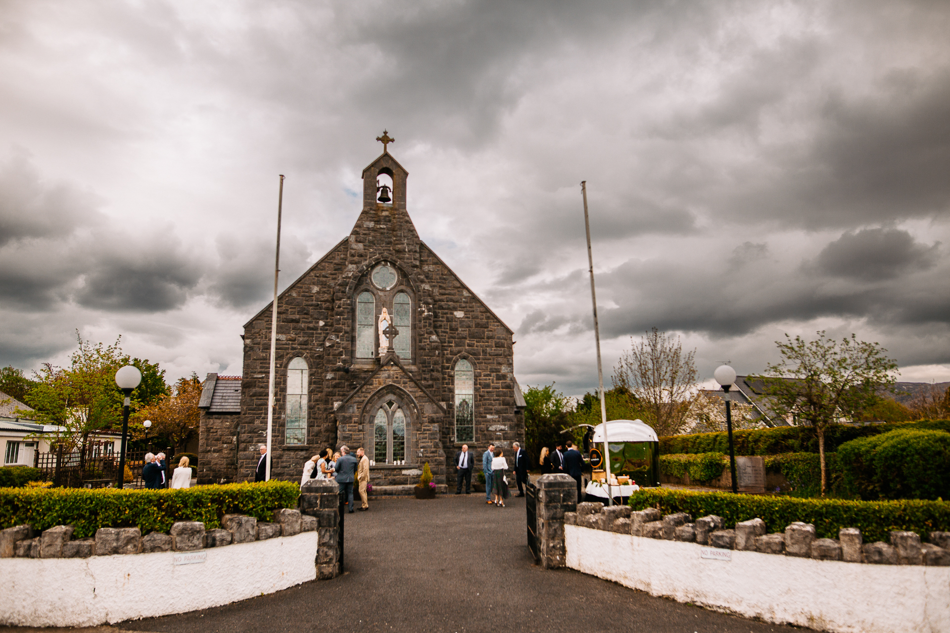 A stone church with a cross on top