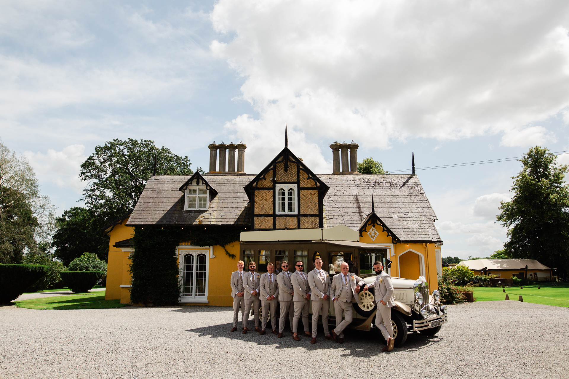 A group of men standing outside a house