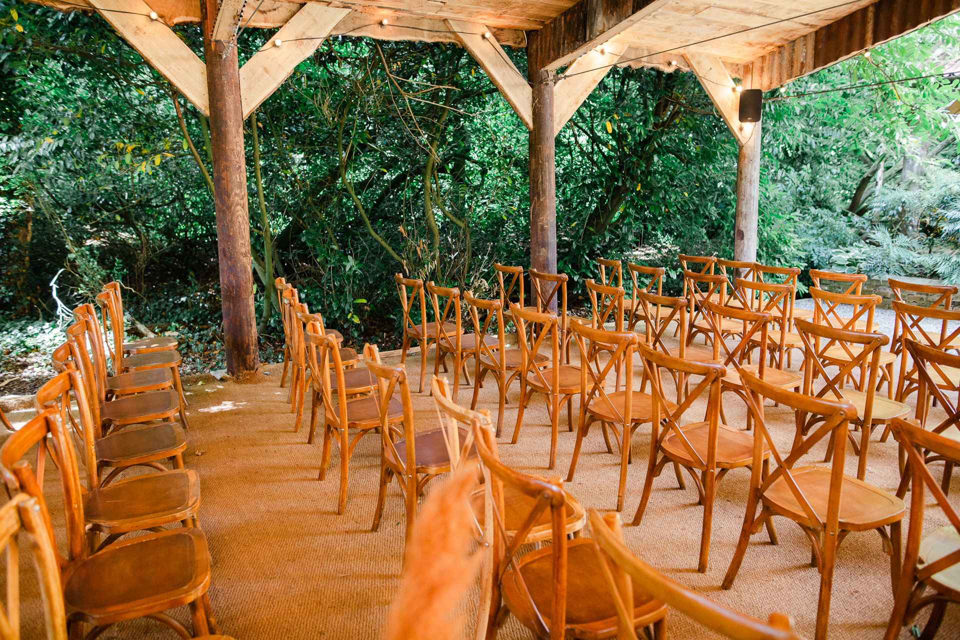 A group of chairs and tables outside